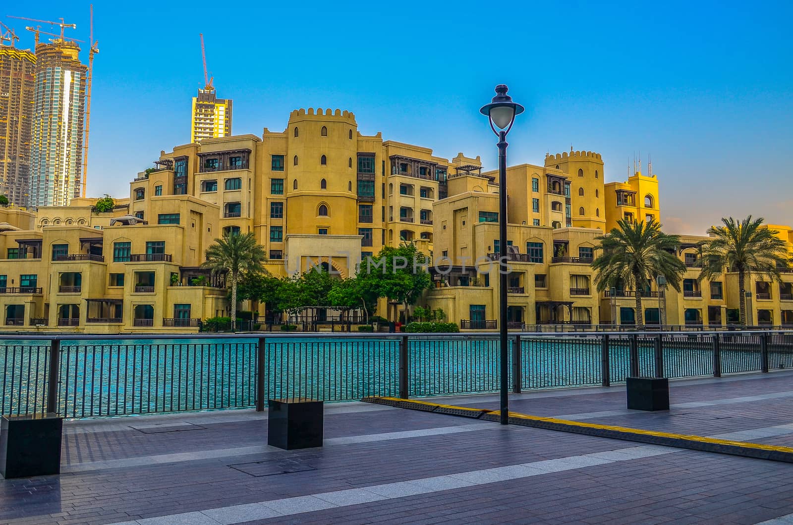 View of the yellow houses from the Burj Park by Emaar promenade near Burj Khalifa. Dubai, UAE.