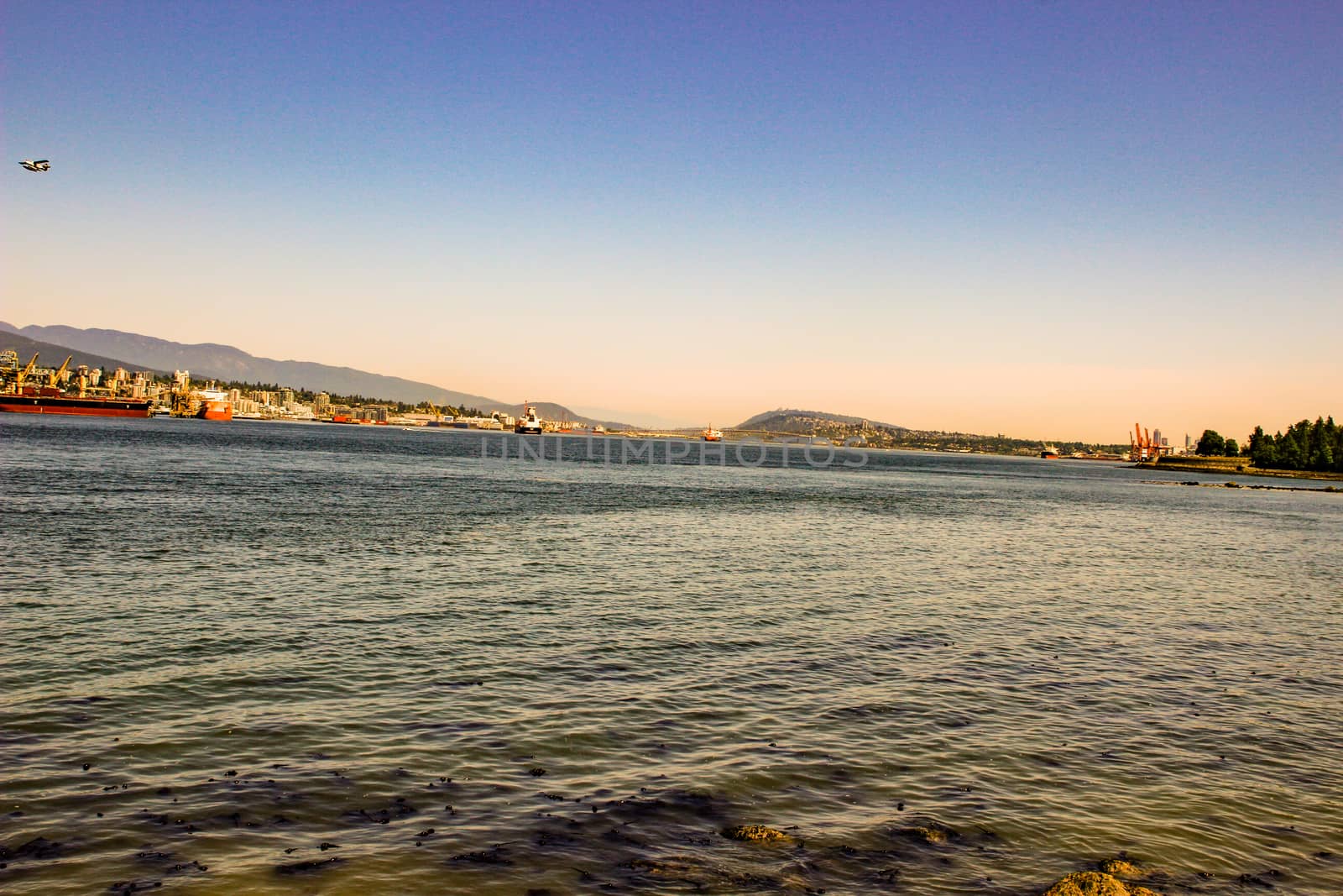 Siwash Rock in Stanley Park at sunrise in Vancouver. by mynewturtle1