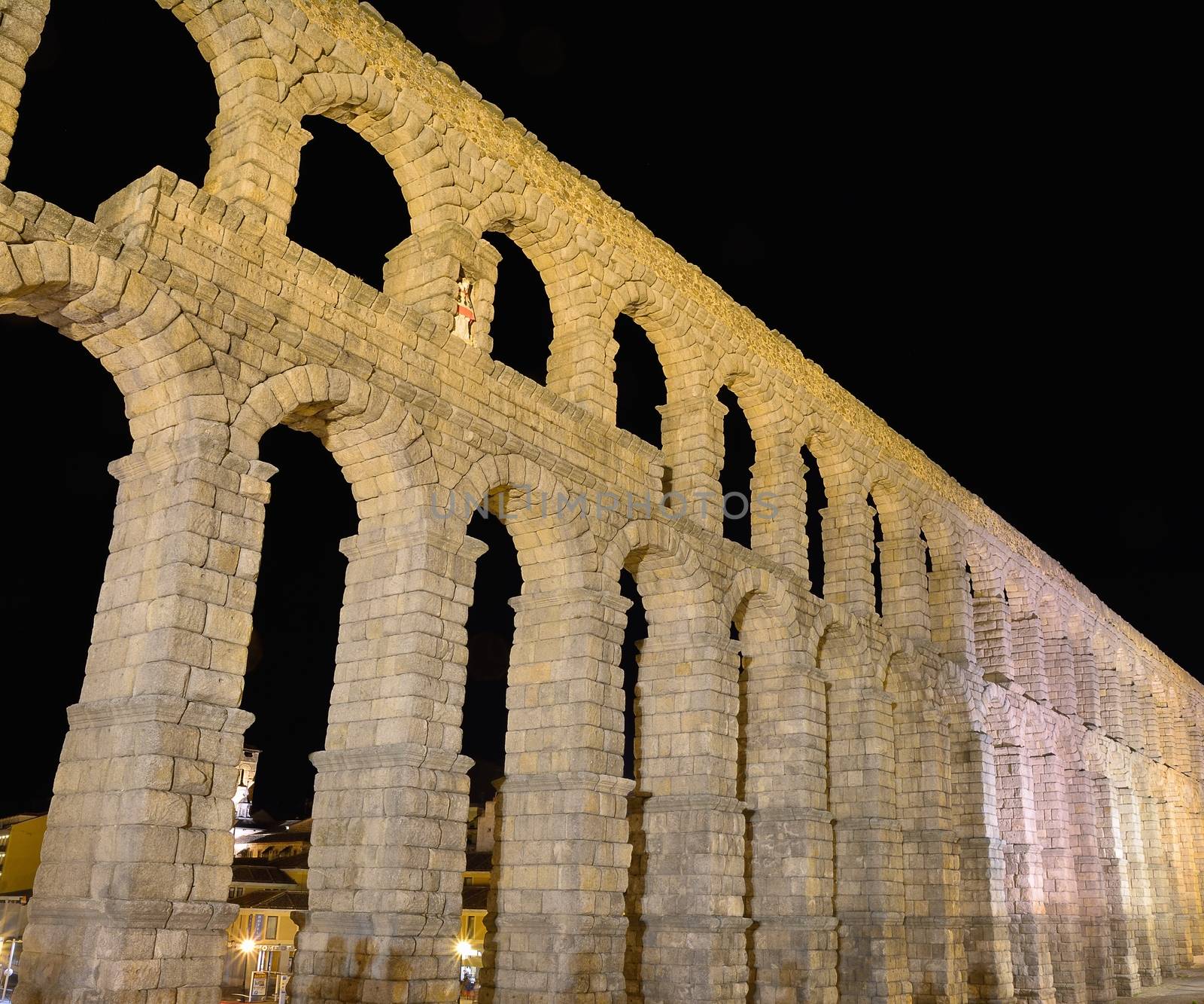 Night view of famous ancient aqueduct in Segovia, Castilla y Leon, Spain.