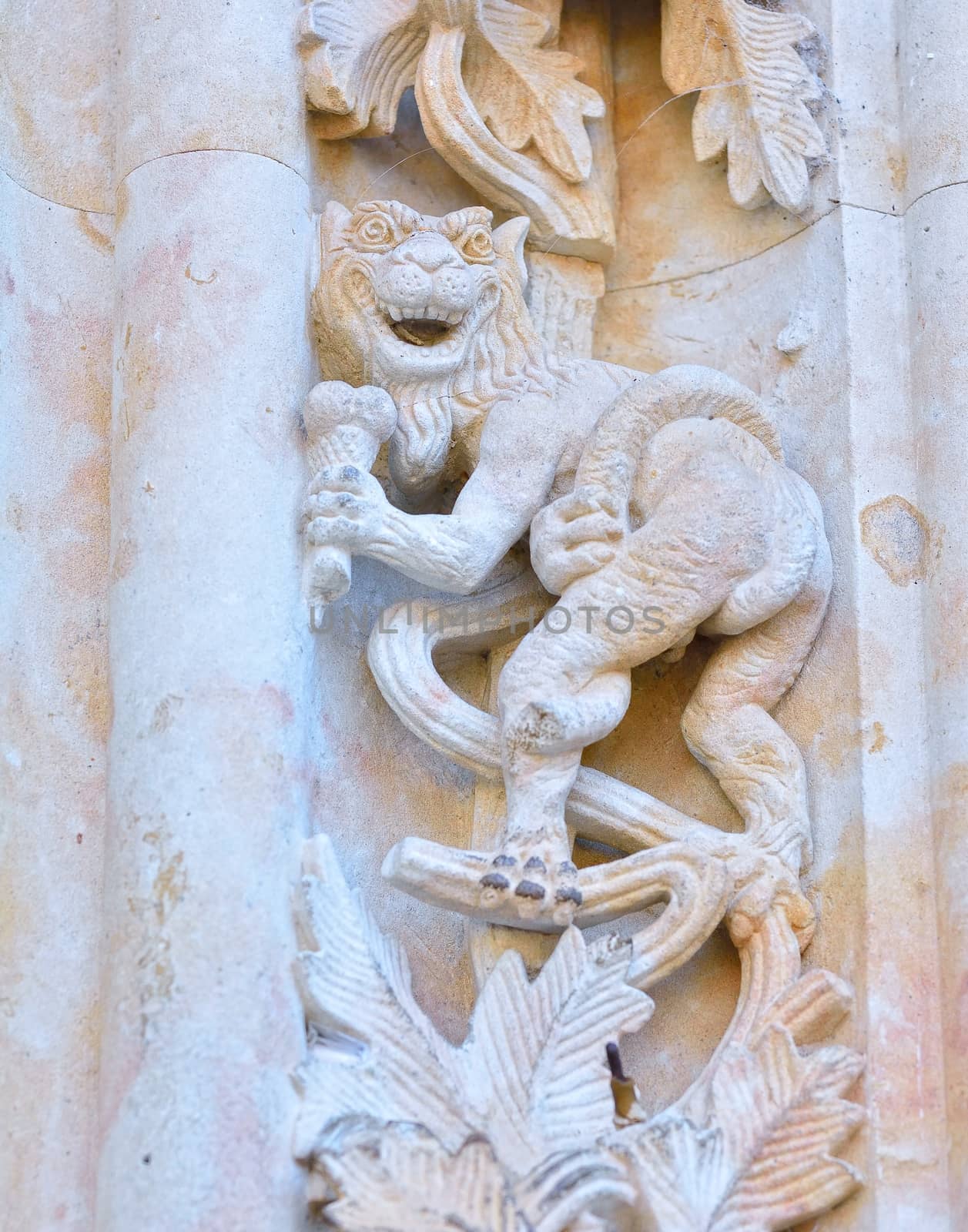 Devil carved on the facade of the cathedral of Salamanca in Spain