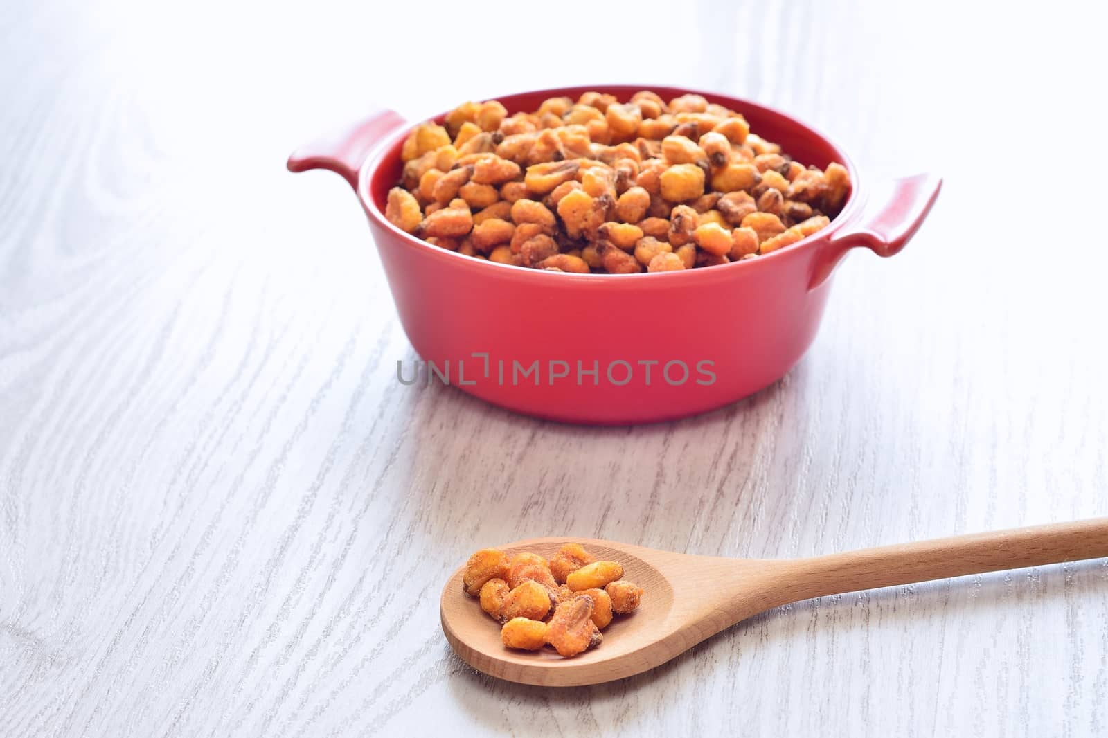 Toasted corn on the wooden table in the kitchen.