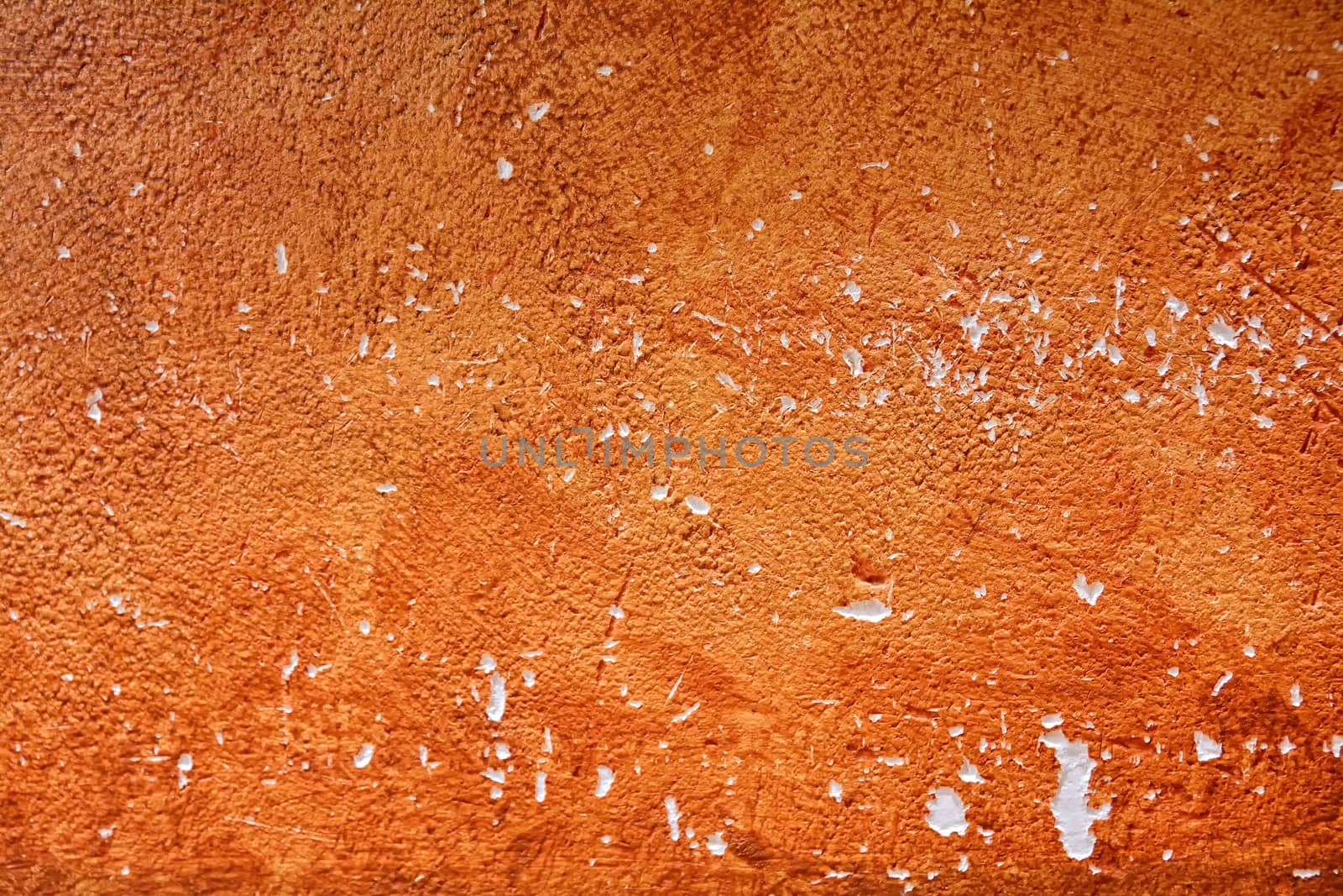 Background painted wall with damage to orange