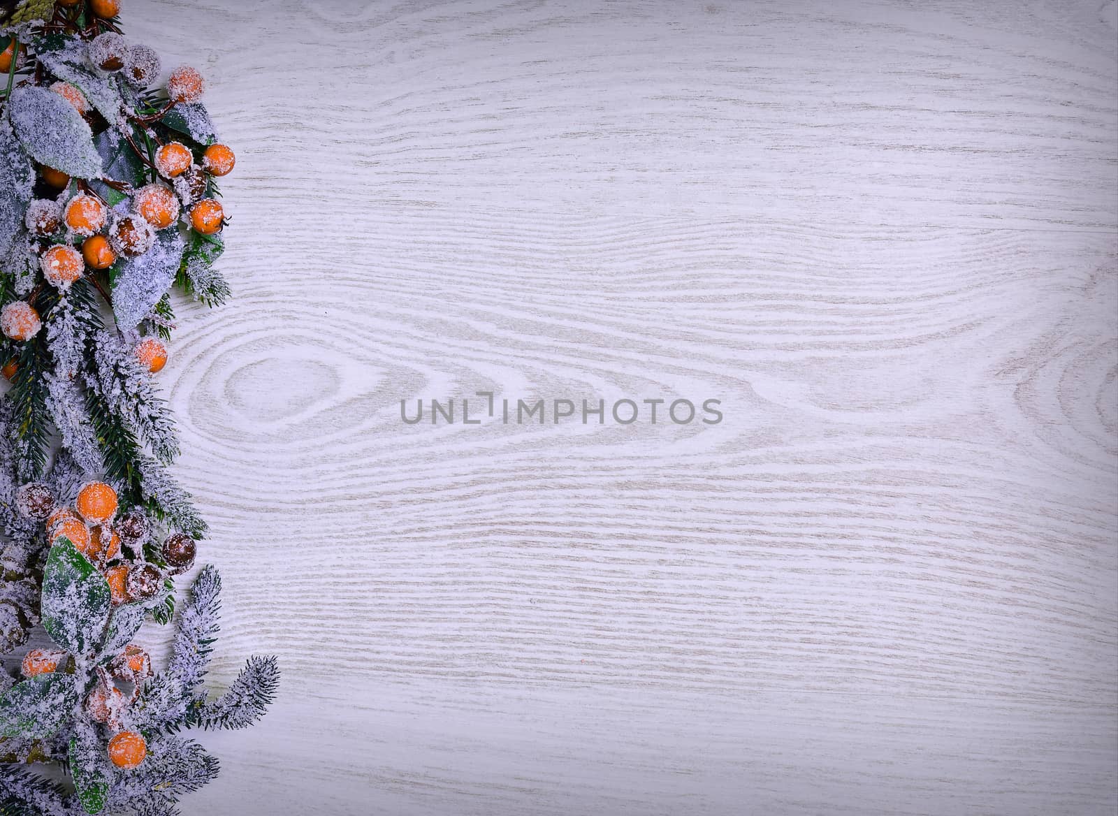 Christmas decoration full of frost on the wooden table