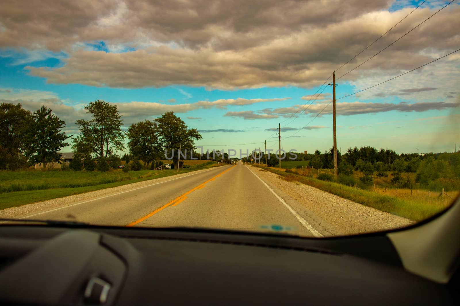Driving through countryside. Travelling, road, way, summer, vacation, ontheroad, forward, clouds, cloudy, cloudsky, beautifulclouds, awesome, weather, seasons.