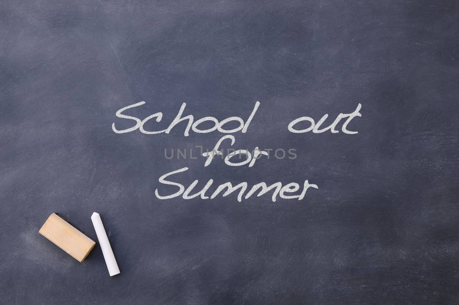 Blackboard with the phrase School out for summer.