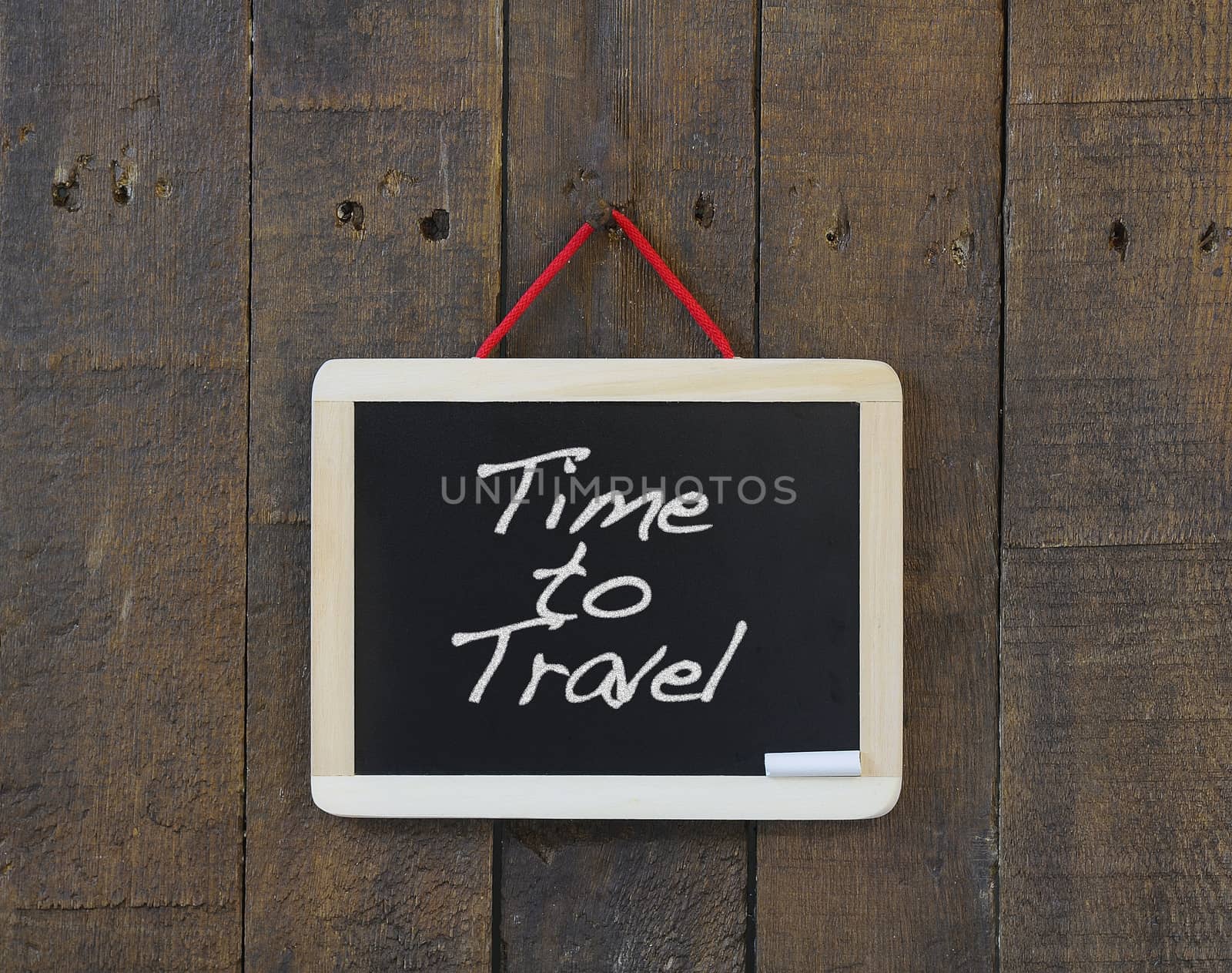 Blackboard hanging with the phrase Time to Travel.