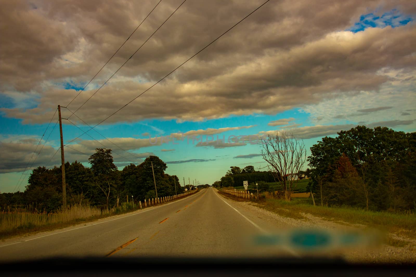 Driving through countryside. Travelling, road, way, summer, vacation, ontheroad, forward, clouds, cloudy, cloudsky, beautifulclouds, awesome, weather, seasons.