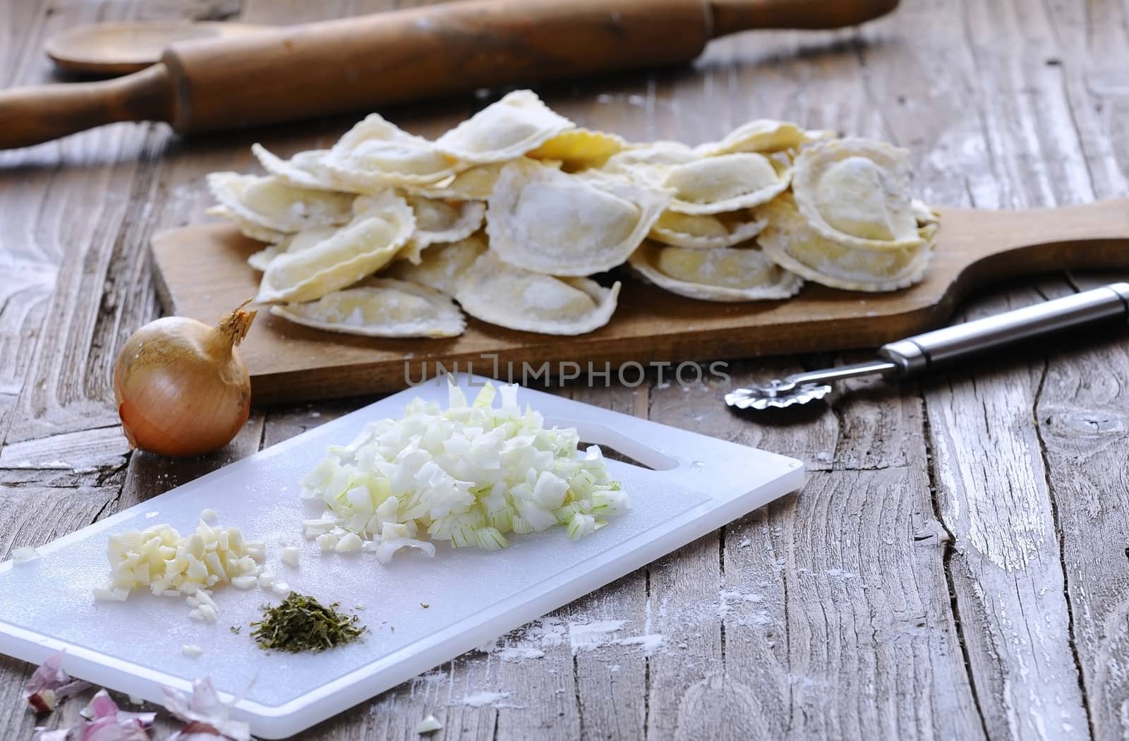 Preparing fresh ravioli at the kitchen table.