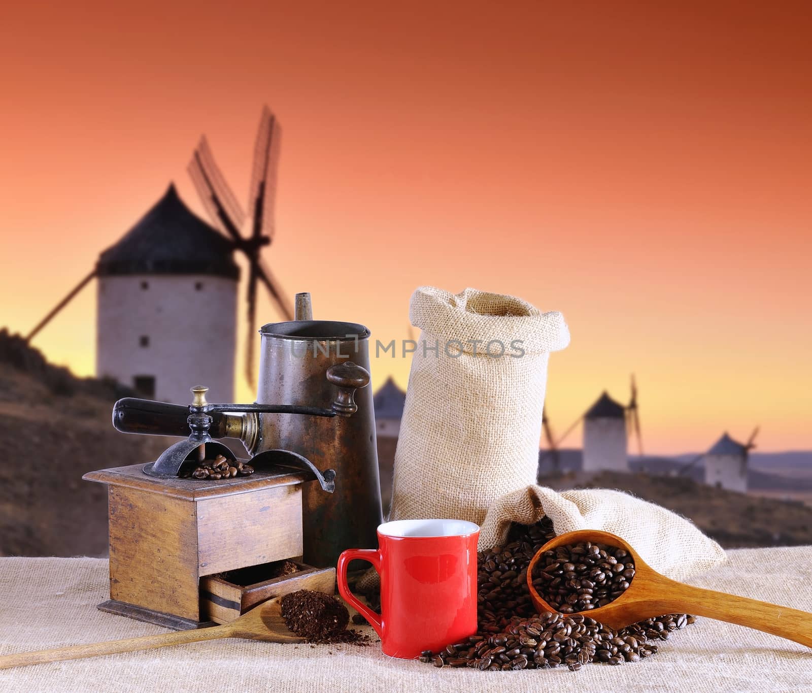 Coffee cup and old windmill in background.