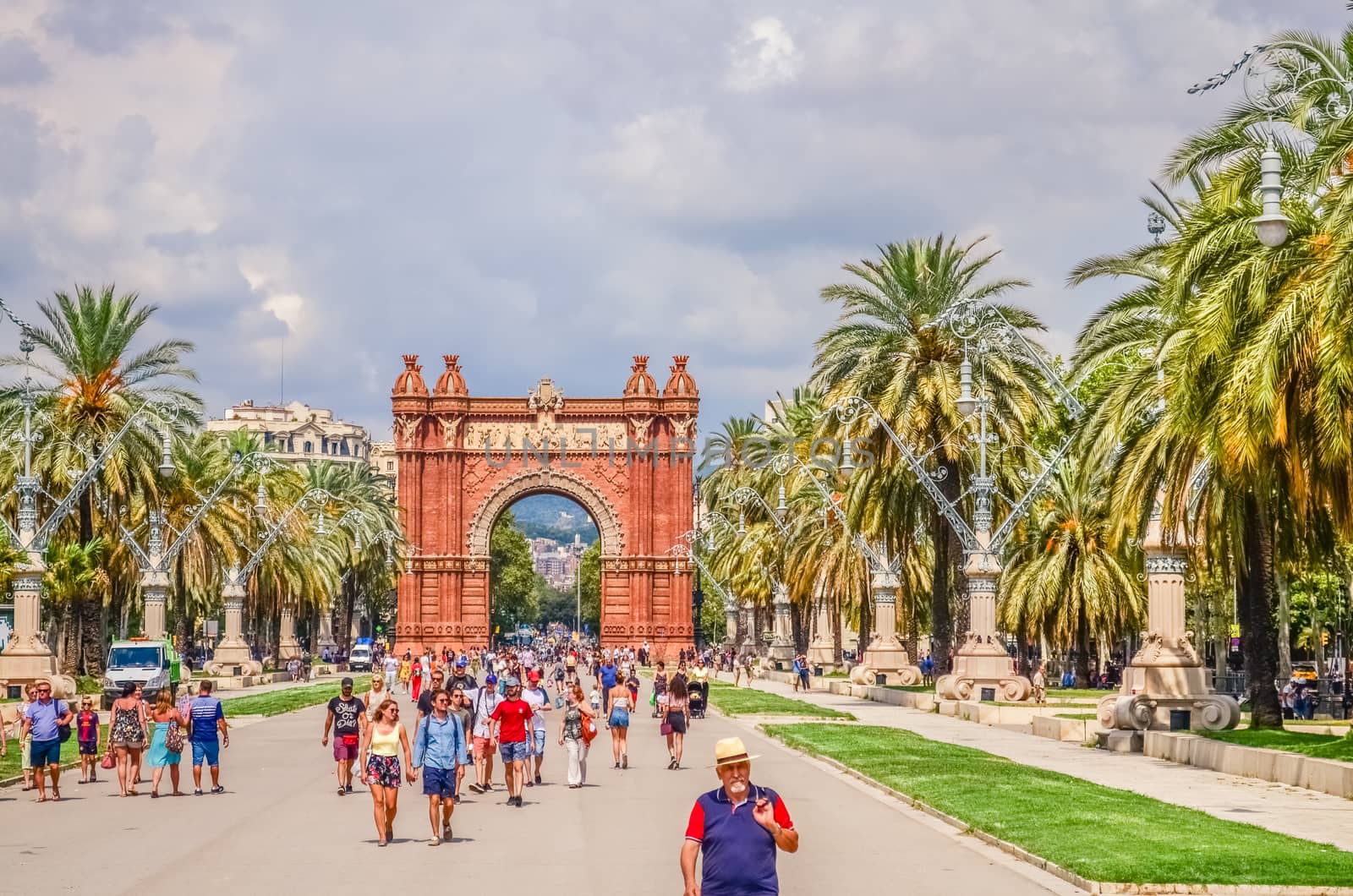 Promenade Passeig de Lluis Companys and the Arc de Triomf - a triumphal arch in the city of Barcelona in Catalonia, Spain.