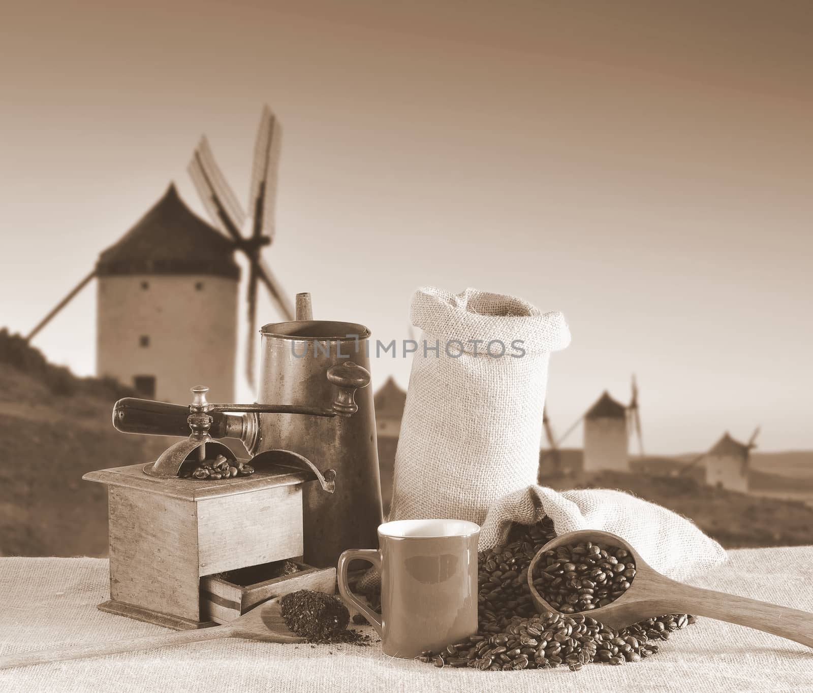 Coffee cup and old windmill in background.