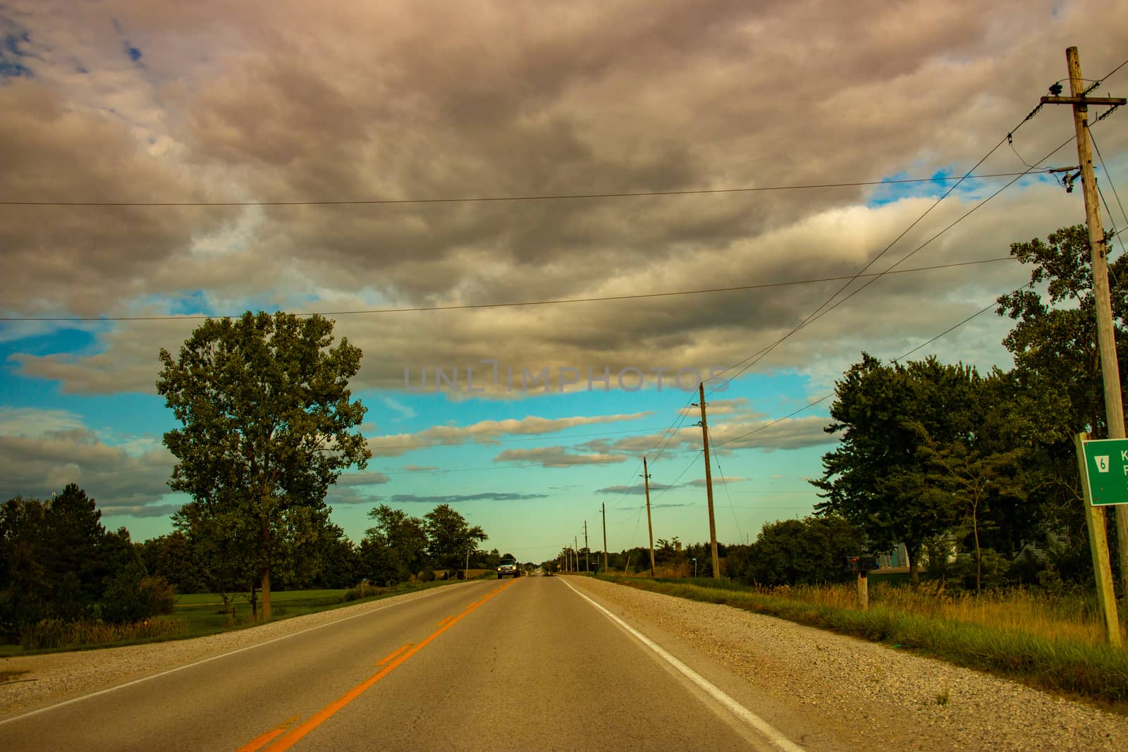 Driving through countryside. Travelling, road, way, summer, vacation, ontheroad, forward, clouds, cloudy, cloudsky, beautiful clouds, awesome, weather, seasons by mynewturtle1