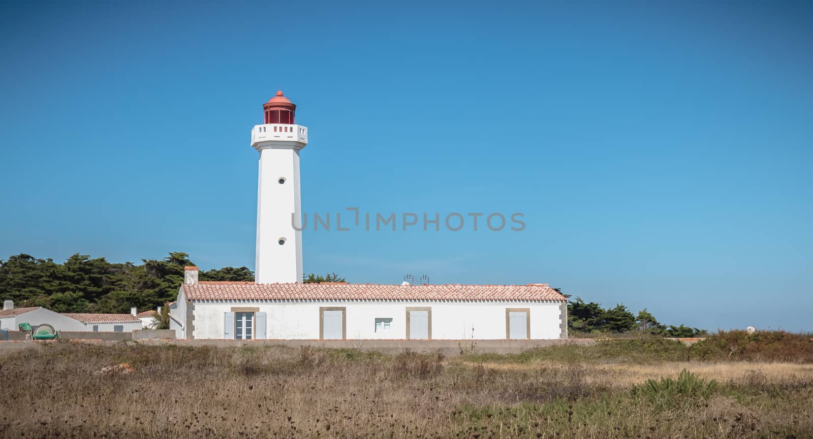 Port Joinville, France - September 17, 2018 - Architectural detail of the Corbeaux Marine Lighthouse on a summer day