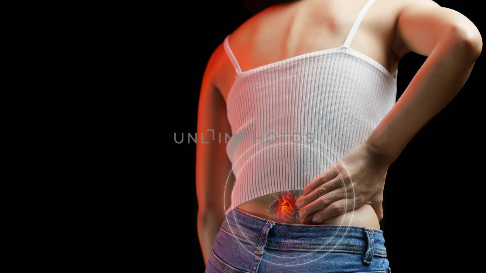 Lower back pain. Woman holding her back in pain. Medical concept.