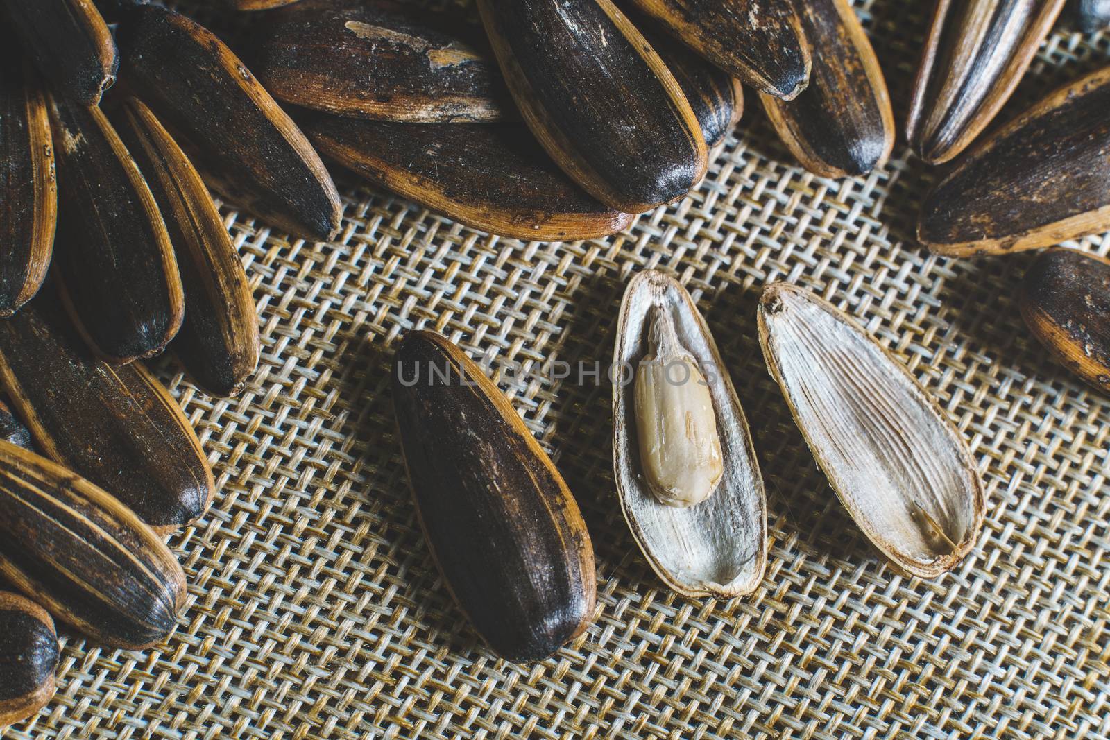 Sunflower seed on a sack background. by sirawit99