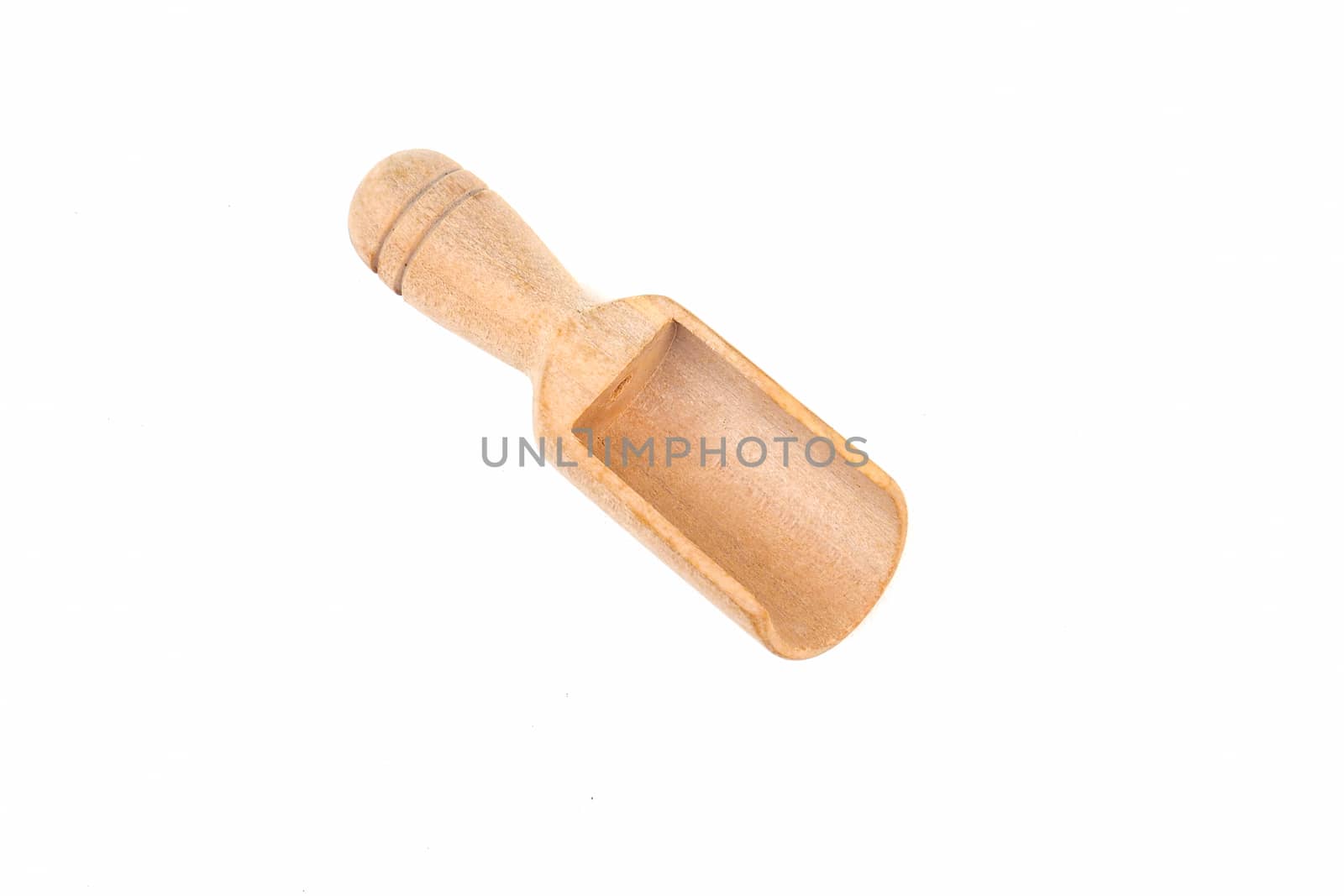 Empty wooden tea spoon on a white background by MEW