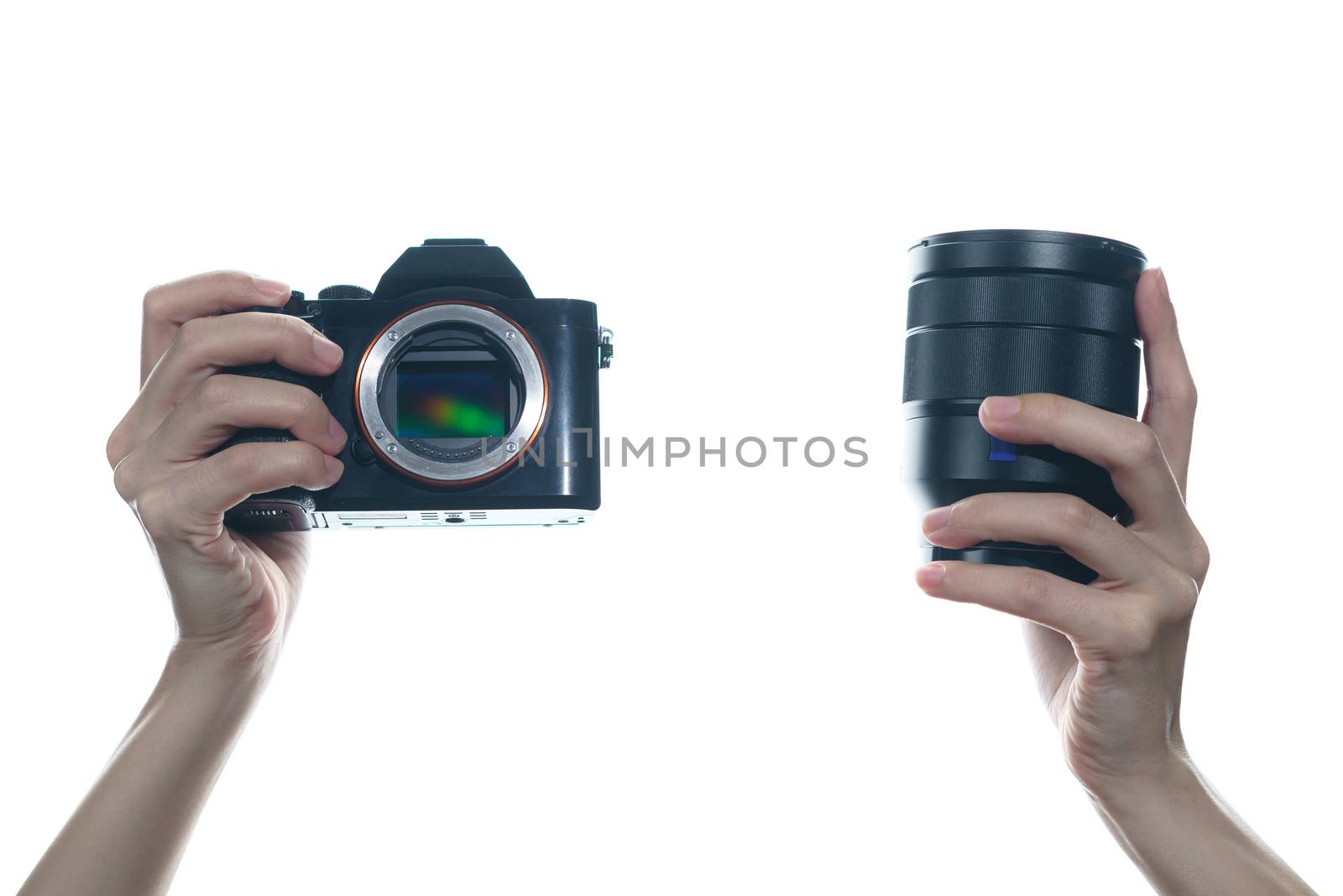 Woman hand holding camera and lens on white background. by sirawit99