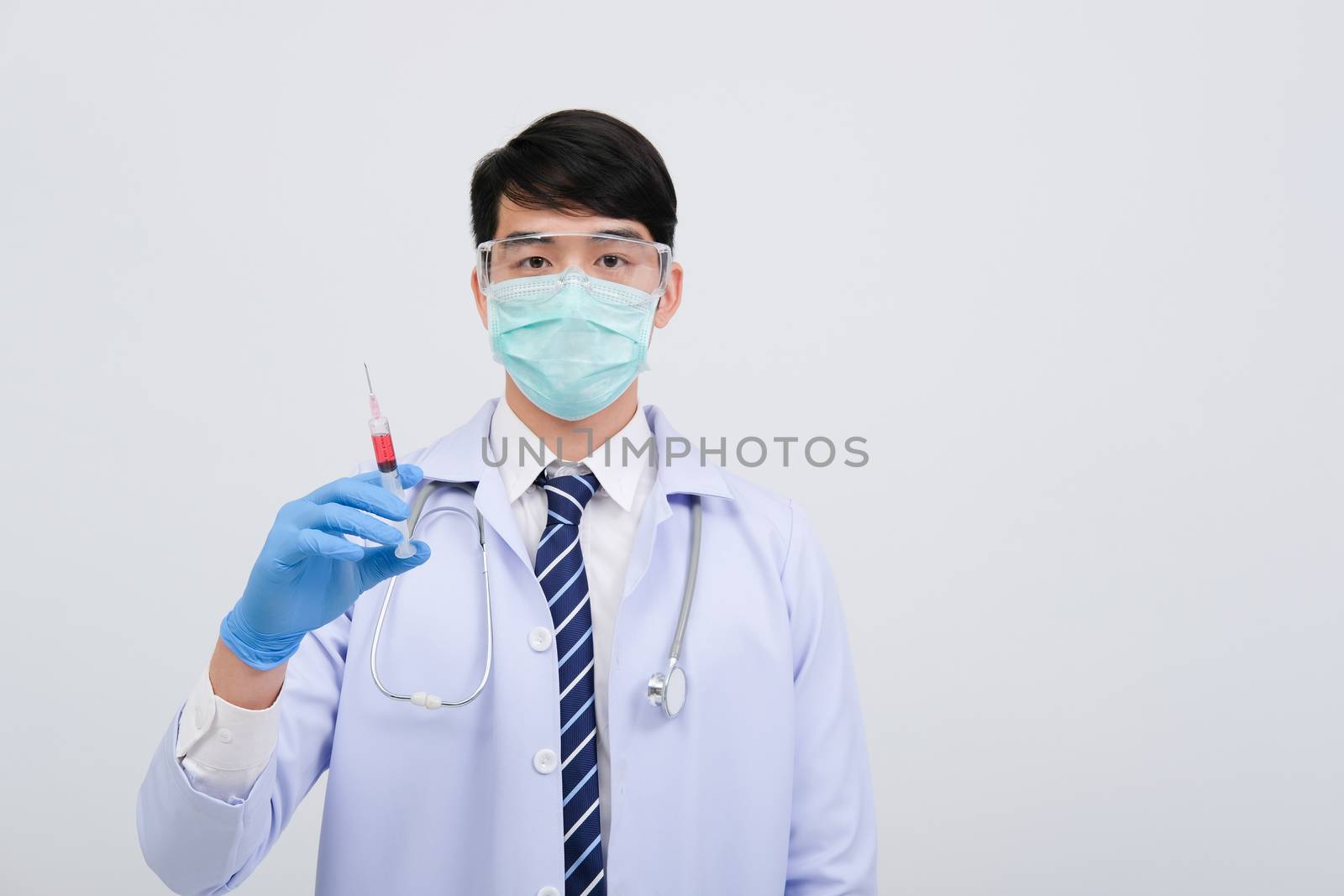 doctor physician practitioner with medicine syringe. medical injection & needle vaccination equipment