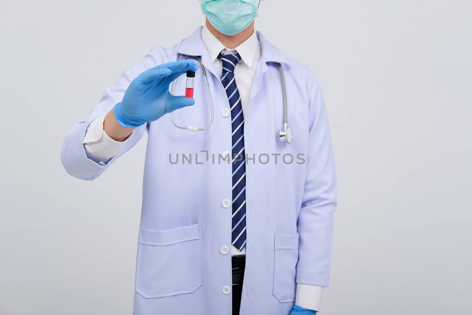 doctor physician practitioner with vaccine medicine vial ampule. by pp99