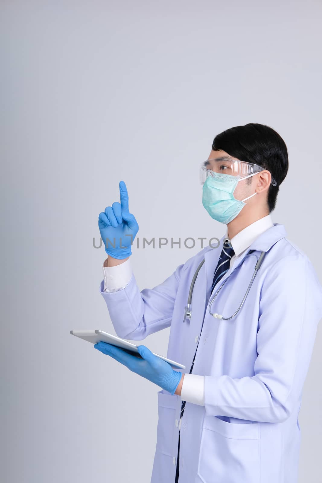 doctor physician practitioner wearing mask with tablet & stethoscope on white background. medical professional medicine healthcare concept