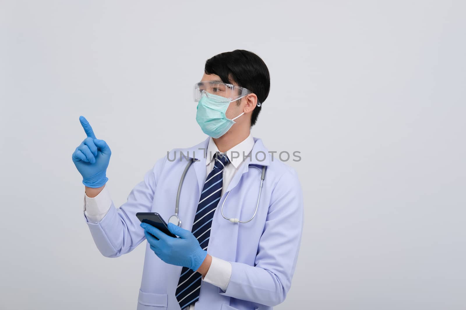 doctor physician practitioner wearing mask with smartphone & stethoscope on white background. medical professional medicine healthcare concept