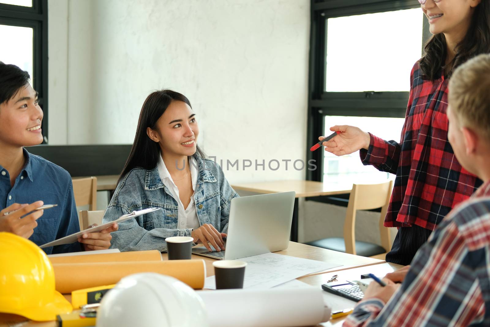 architect engineer interior designer team working discussing on house blueprint of real estate project in meeting. building construction teamwork concept