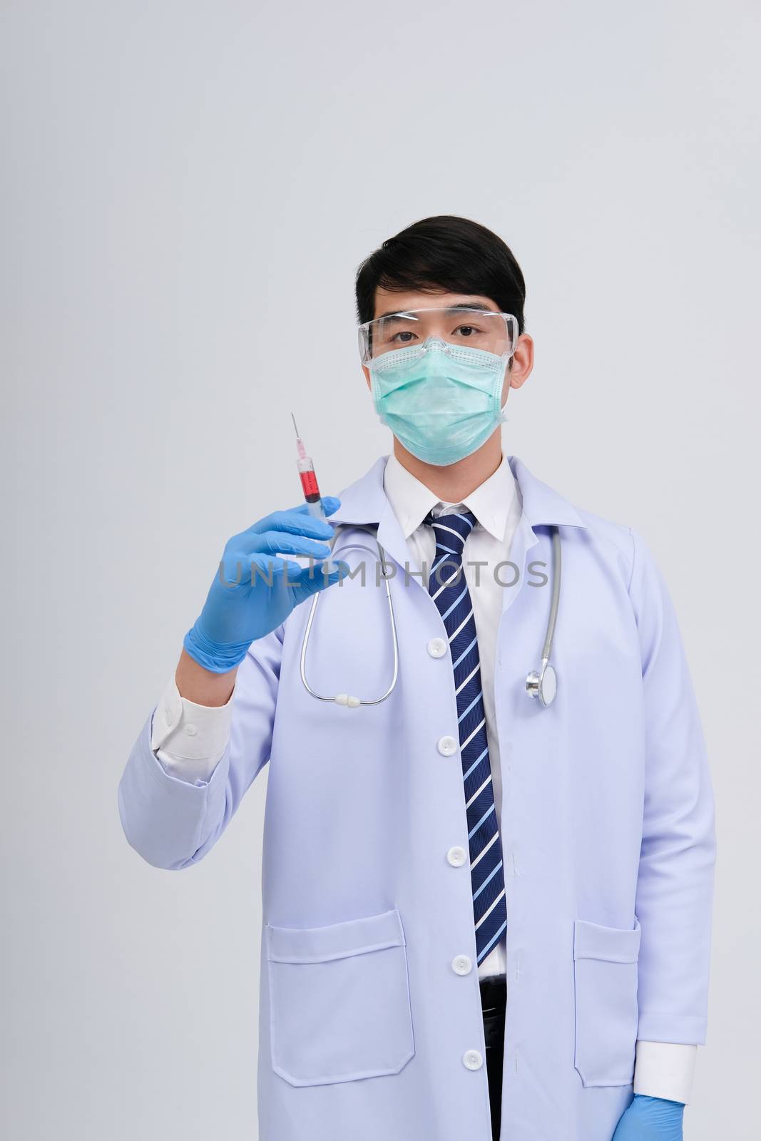 doctor physician practitioner with medicine syringe. medical injection & needle vaccination equipment