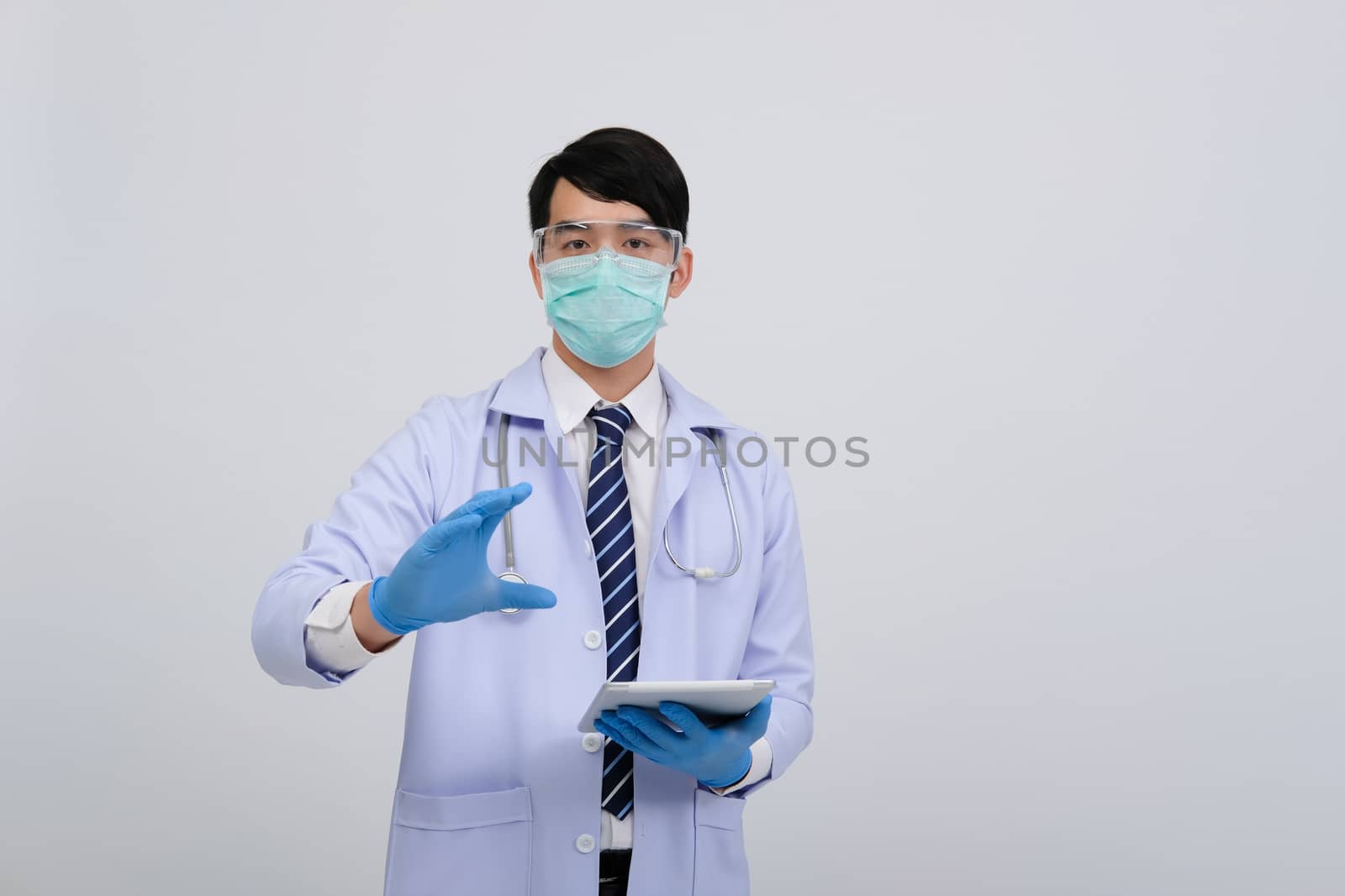 doctor physician practitioner wearing mask with tablet & stethoscope on white background. medical professional medicine healthcare concept