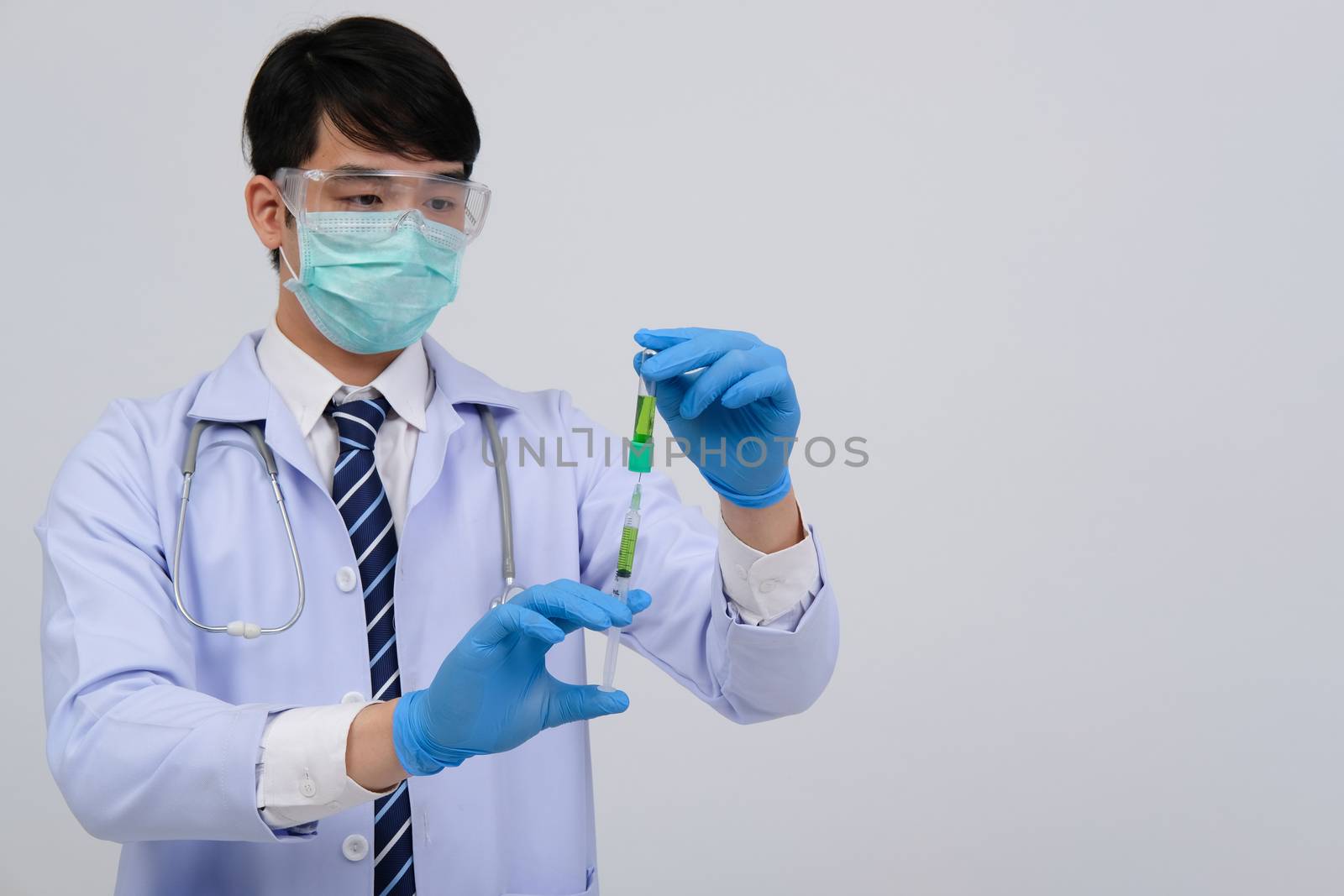 doctor physician practitioner with medicine syringe vial ampule. medical injection & needle vaccination equipment