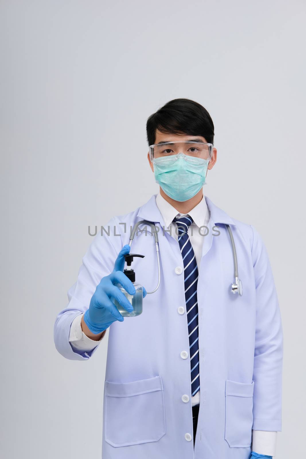doctor physician practitioner with hand washing alcohol sanitizer dispenser for protecting virus bacteria infection. medical healthcare concept