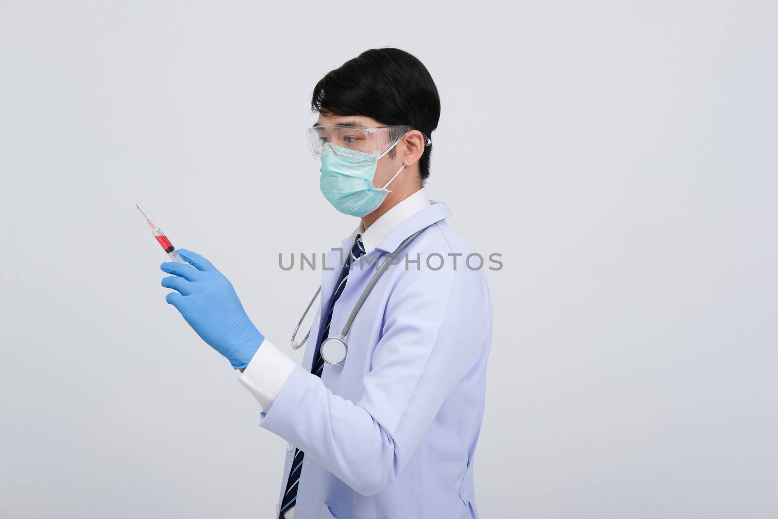 doctor physician practitioner with medicine syringe. medical injection & needle vaccination equipment