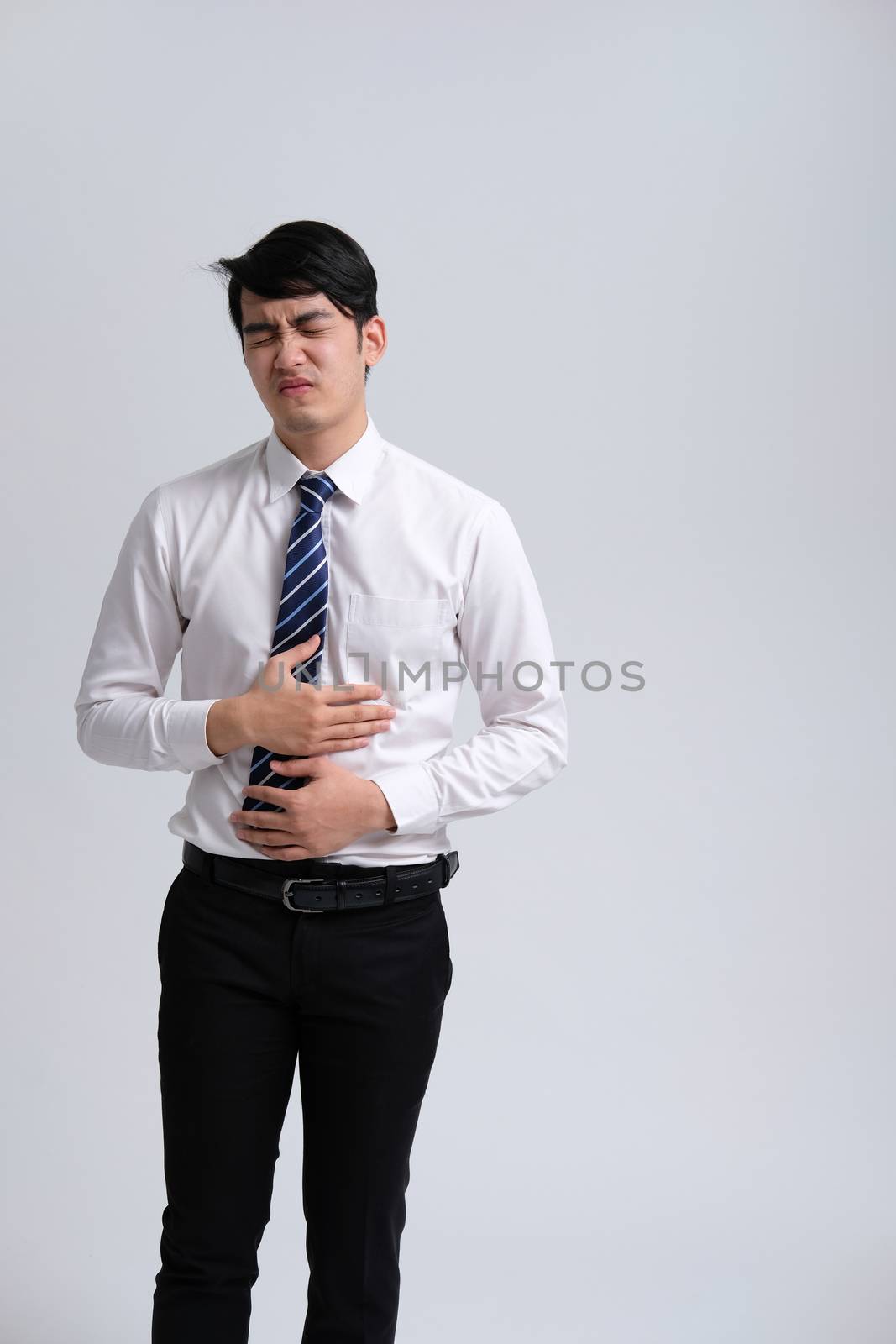 businessman man feeling sick, having painful stomachache. abdominal pain
