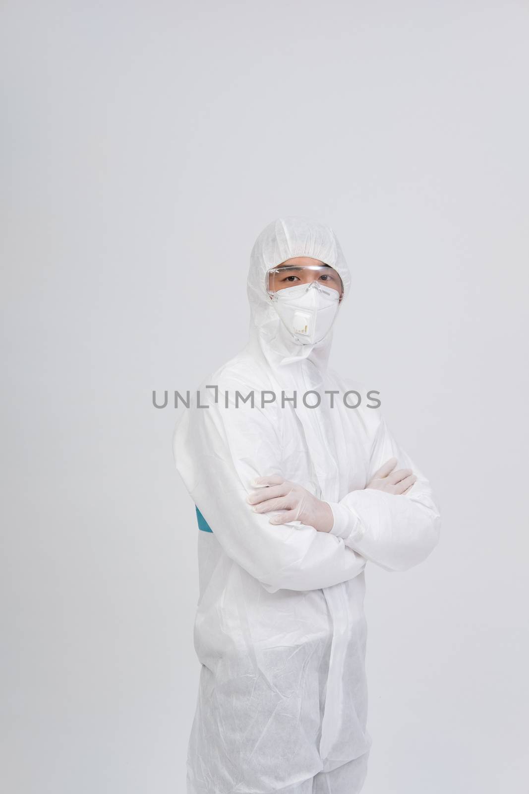 man doctor wearing biological protective uniform suit clothing, mask, gloves for preventing virus bacteria infection contamination