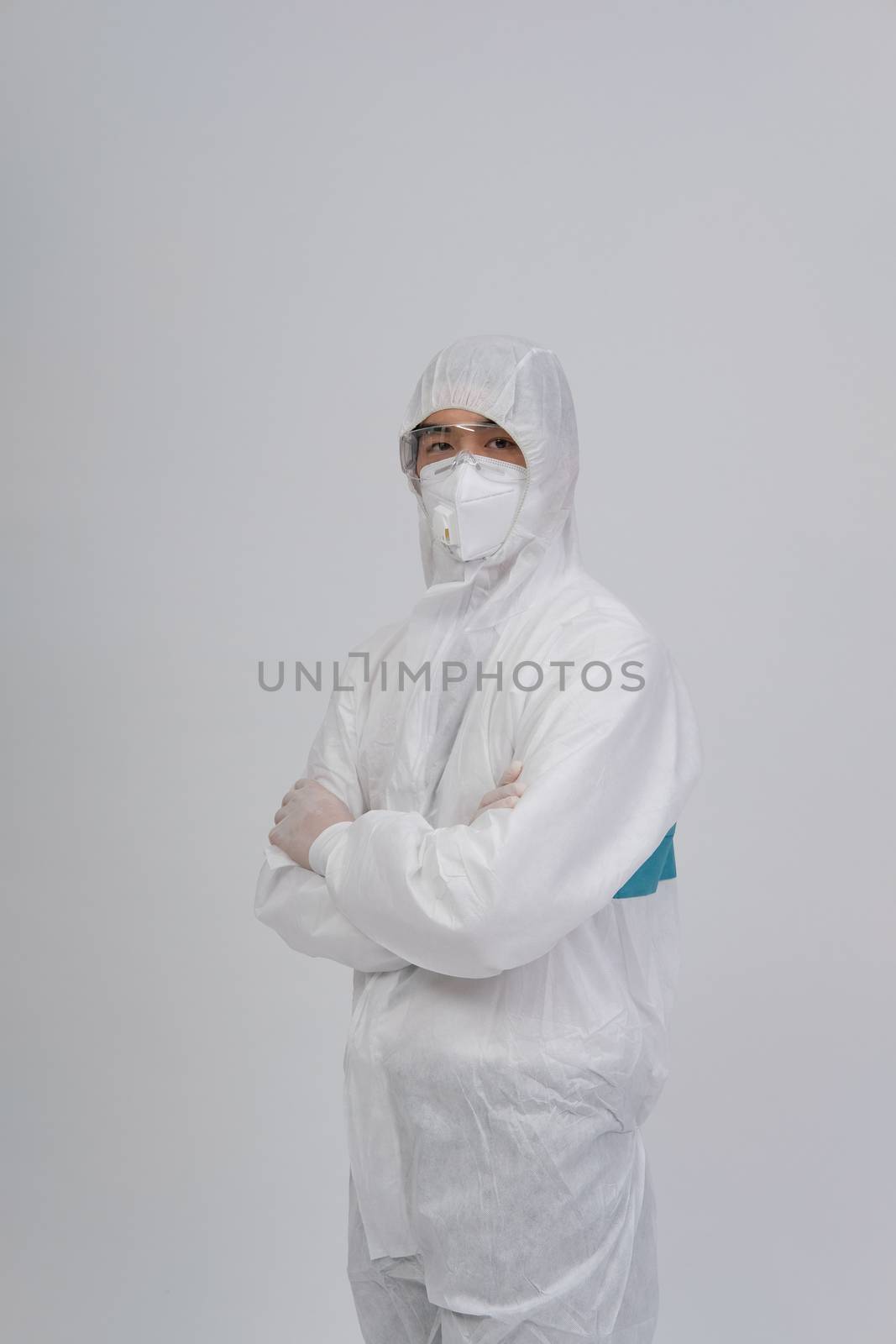 man doctor wearing biological protective uniform suit clothing, mask, gloves for preventing virus bacteria infection contamination