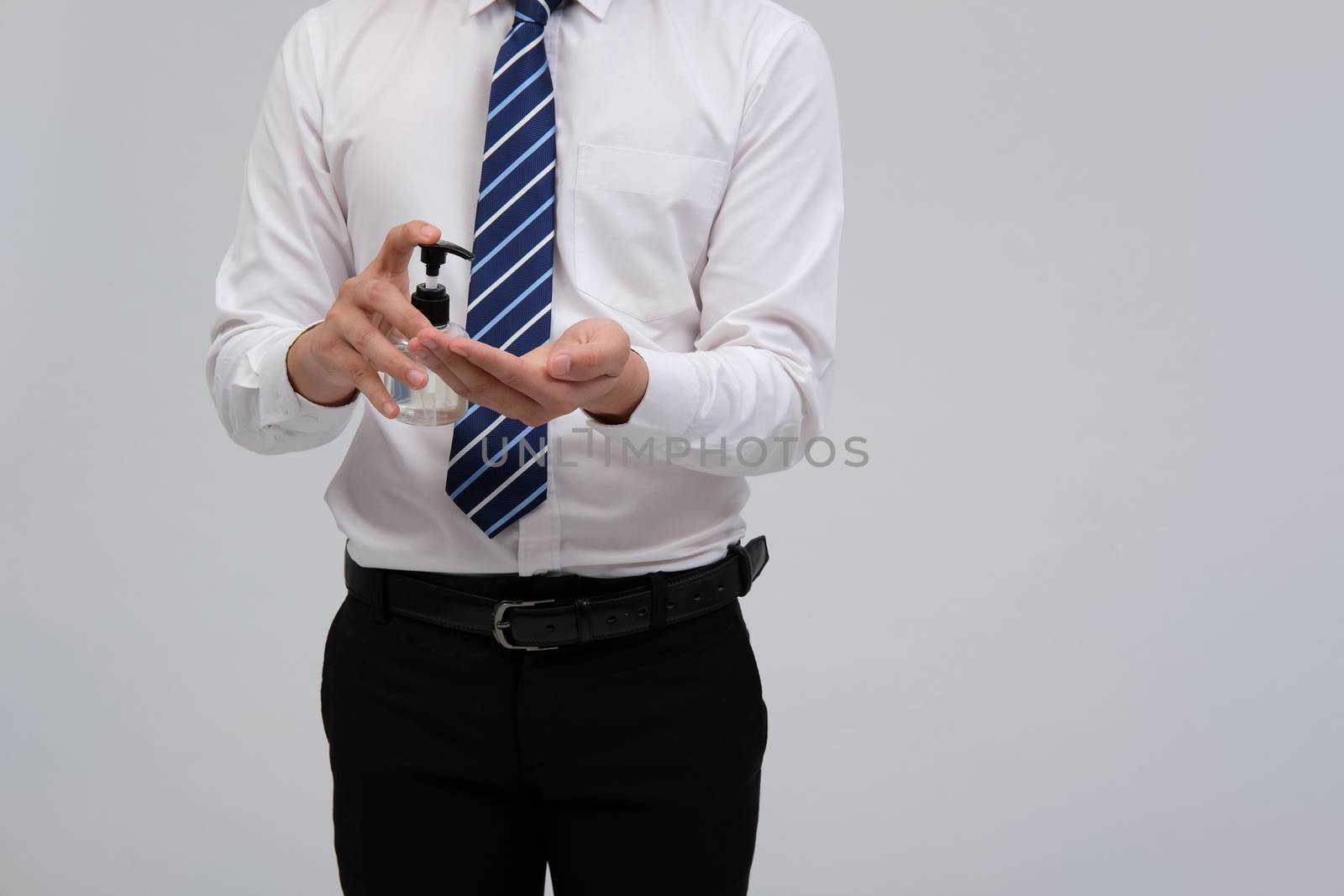 businessman man washing hand with sanitizer dispenser for sanitizing preventing virus bacteria disease infection. health hygiene