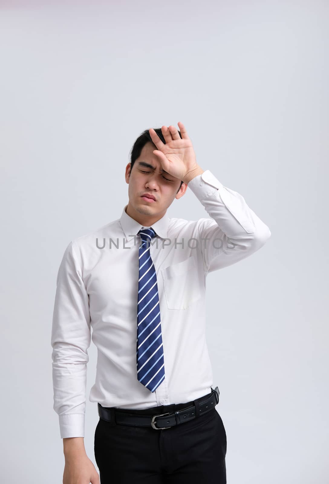 ill businessman man feeling sick, headache from cold flu virus bacteria infection pollution
