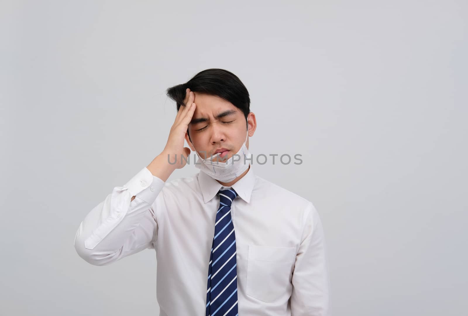 businessman man with thermometer feeling sick, headache from flu covid 19 virus bacteria infection pollution