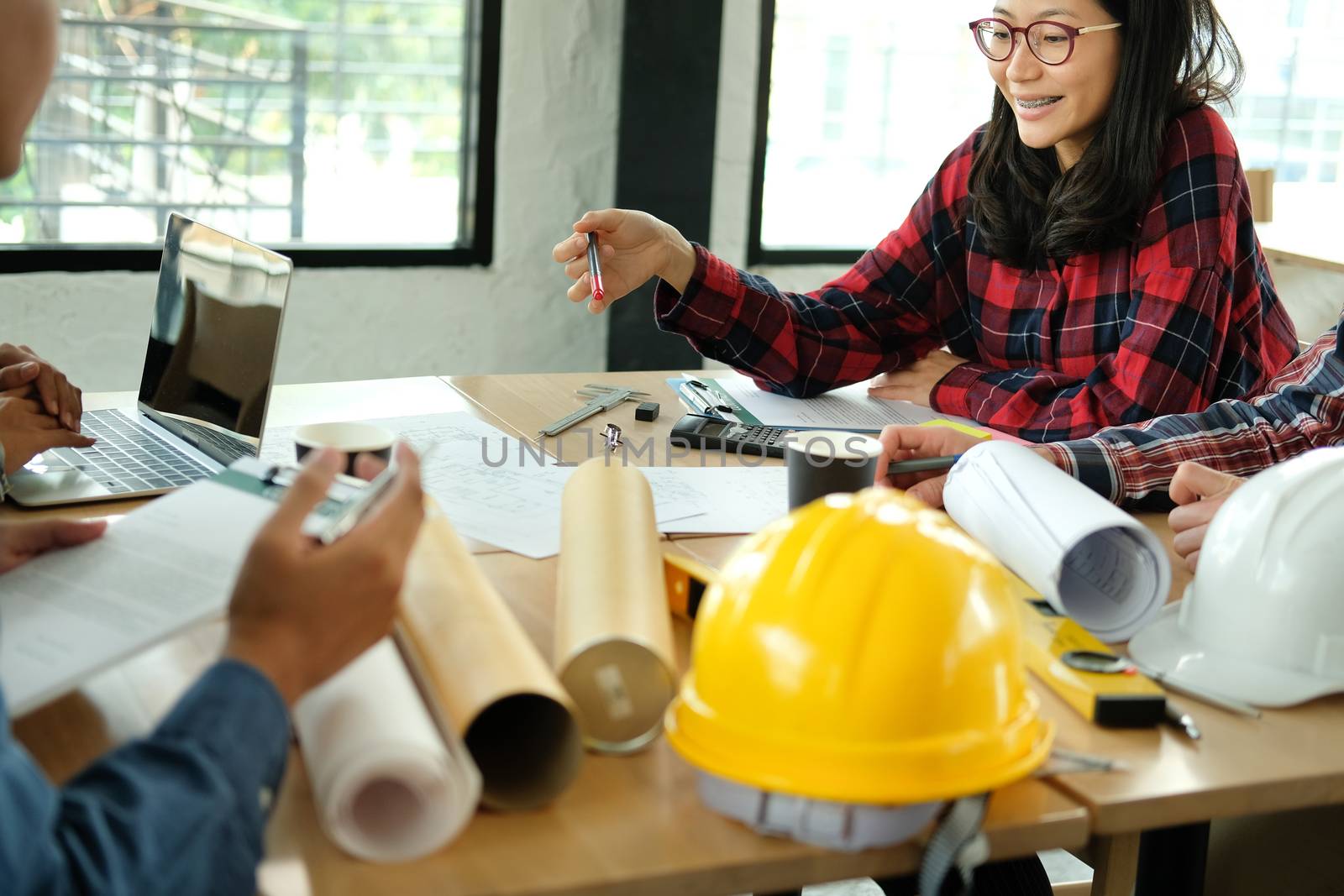 architect engineer interior designer team working discussing on house blueprint of real estate project in meeting. building construction teamwork concept