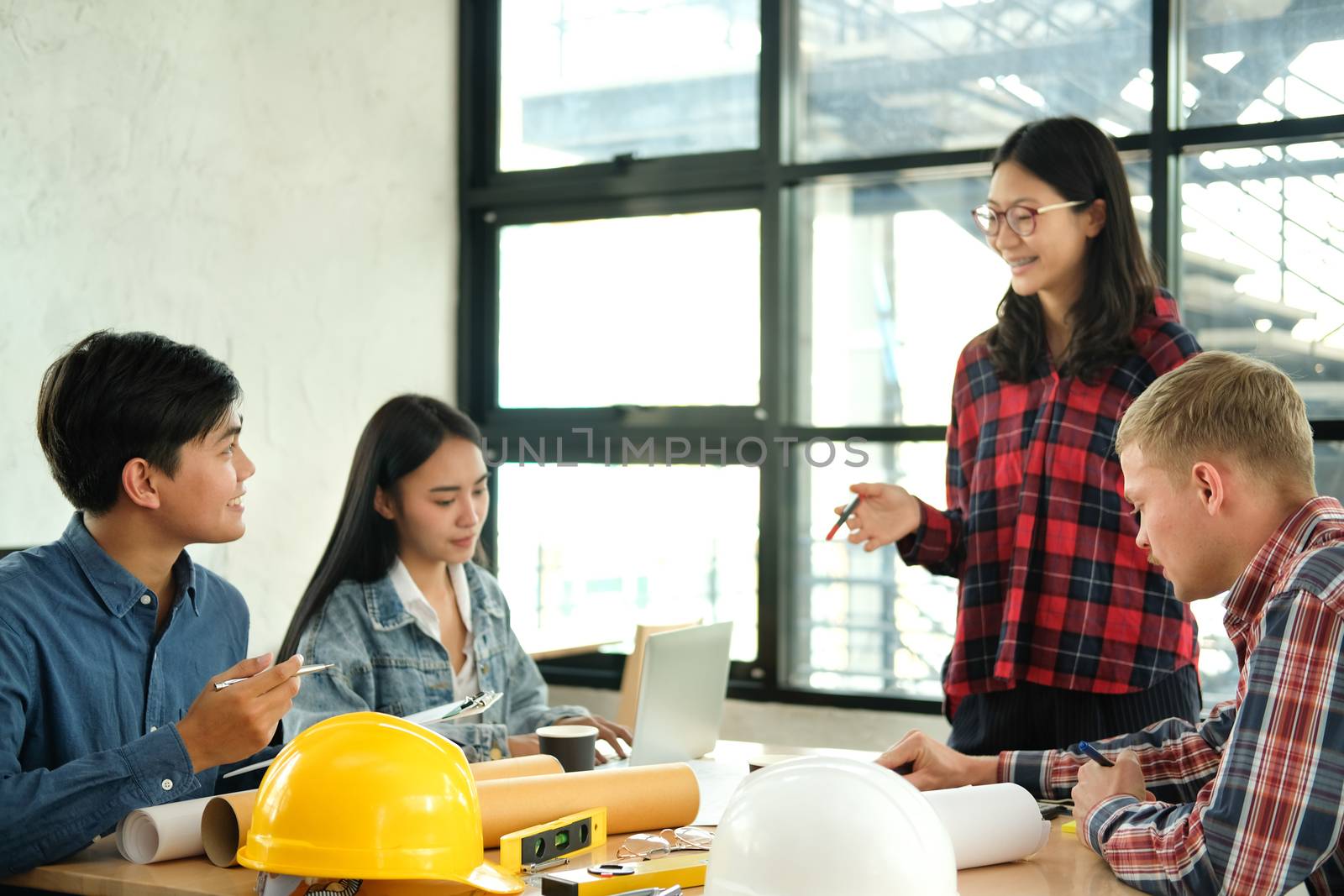 architect engineer interior designer team working discussing on house blueprint of real estate project in meeting. building construction teamwork concept