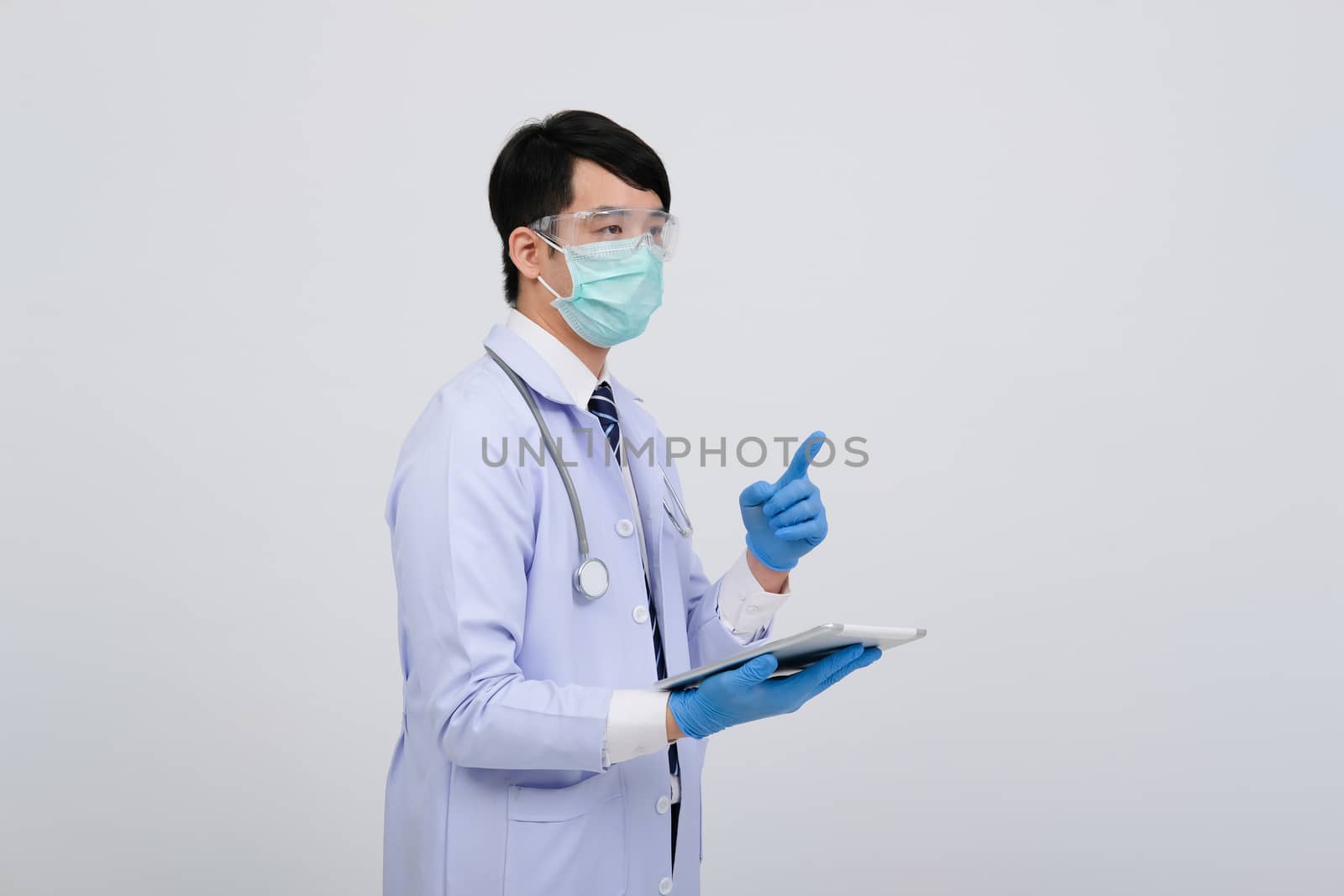doctor physician practitioner wearing mask with tablet & stethoscope on white background. medical professional medicine healthcare concept