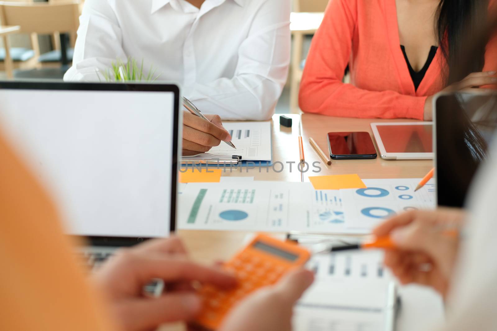 business people discussing on performance revenue in meeting. businessman working with co-worker team. financial adviser analyzing data with investor.