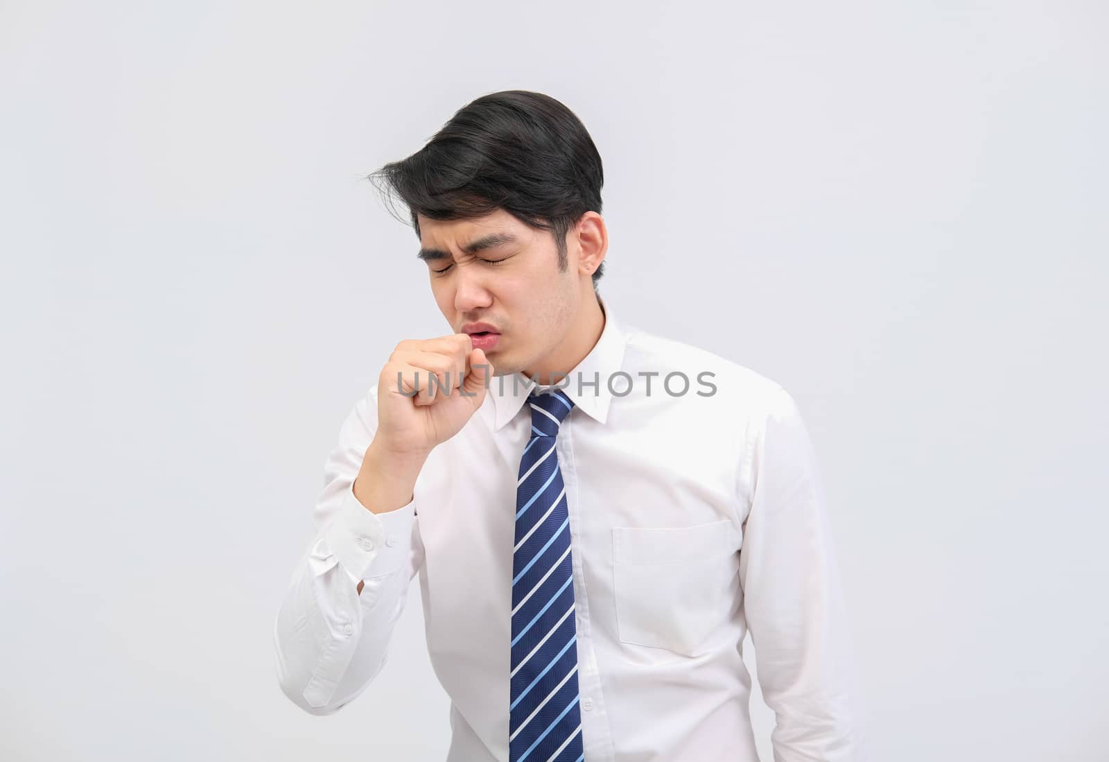 ill businessman man feeling sick, sneezing coughing from cold flu virus bacteria infection pollution