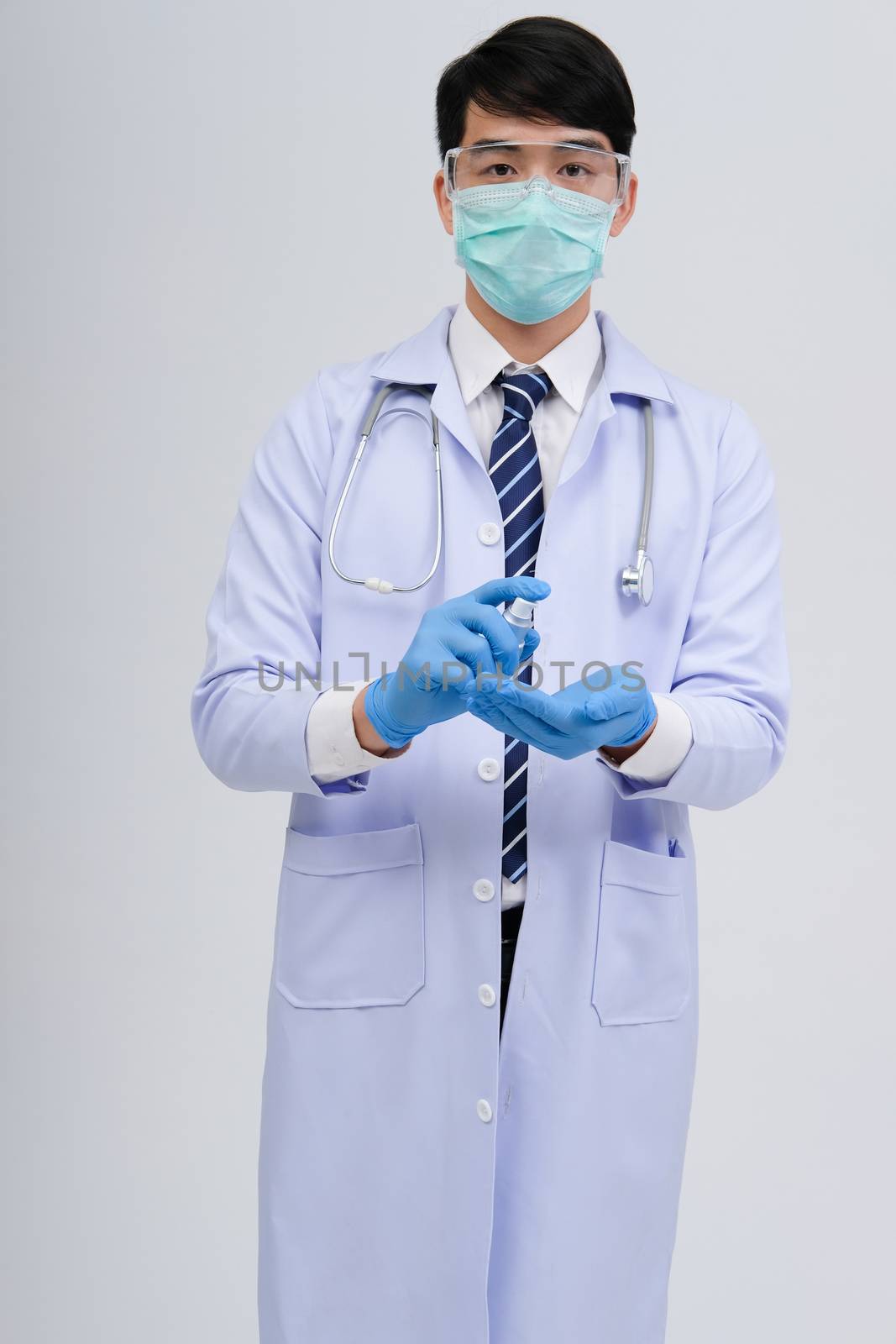 doctor physician practitioner with hand washing alcohol sanitizer dispenser for protecting virus bacteria infection. medical healthcare concept