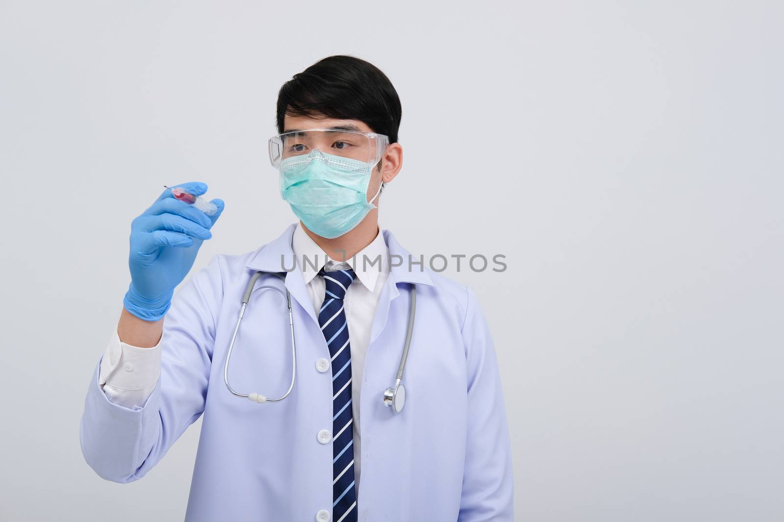 doctor physician practitioner with medicine syringe. medical injection & needle vaccination equipment