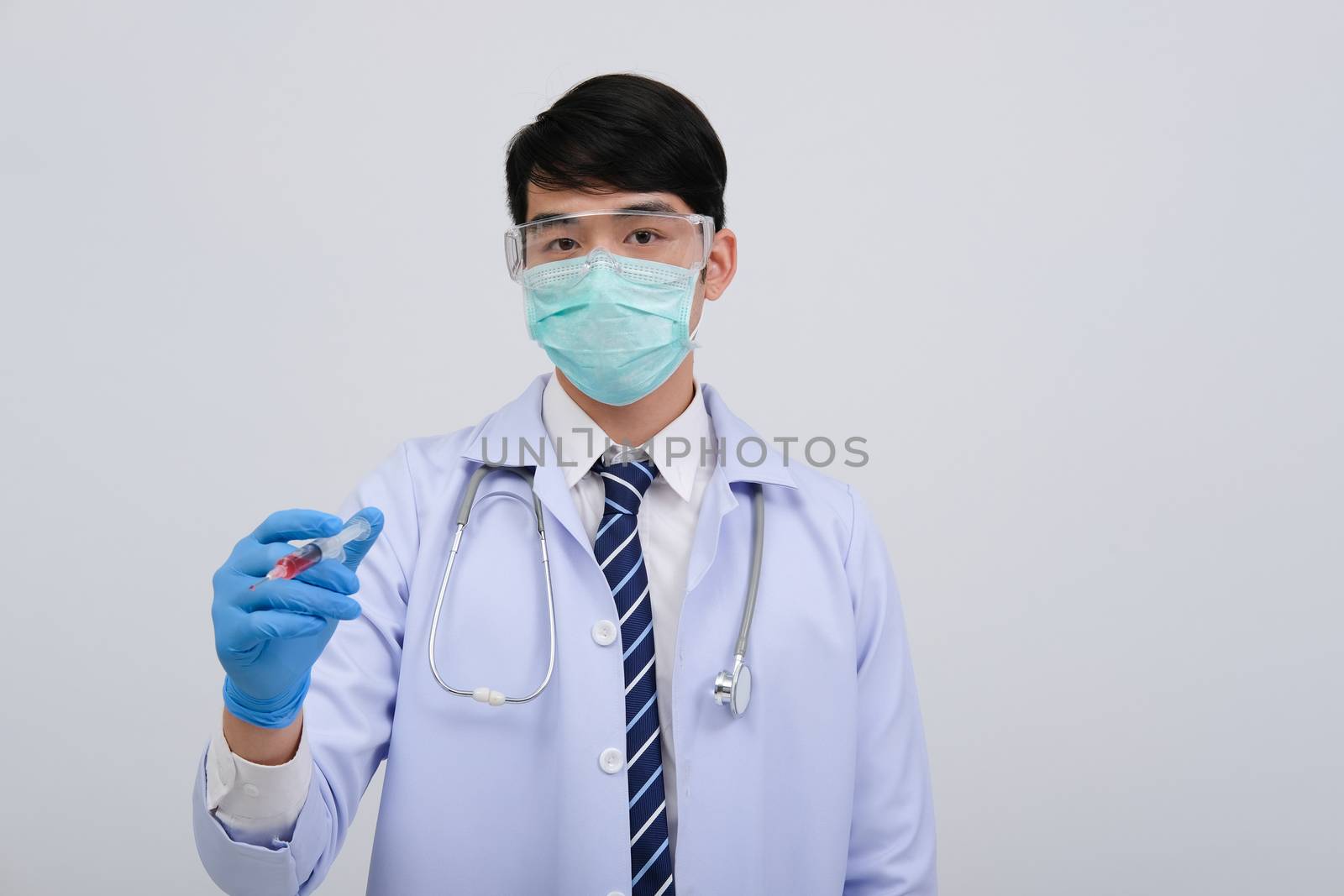 doctor physician practitioner with medicine syringe. medical injection & needle vaccination equipment