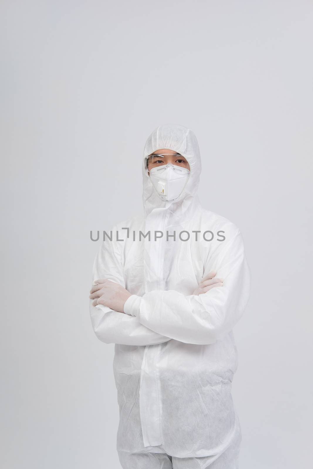 man doctor wearing biological protective uniform suit clothing, mask, gloves for preventing virus bacteria infection contamination