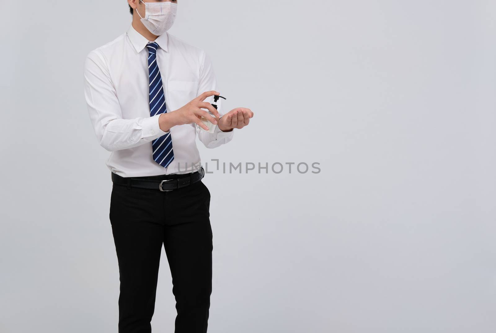 businessman man washing hand with alcohol sanitizer dispenser for sanitizing preventing virus bacteria disease infection. health hygiene