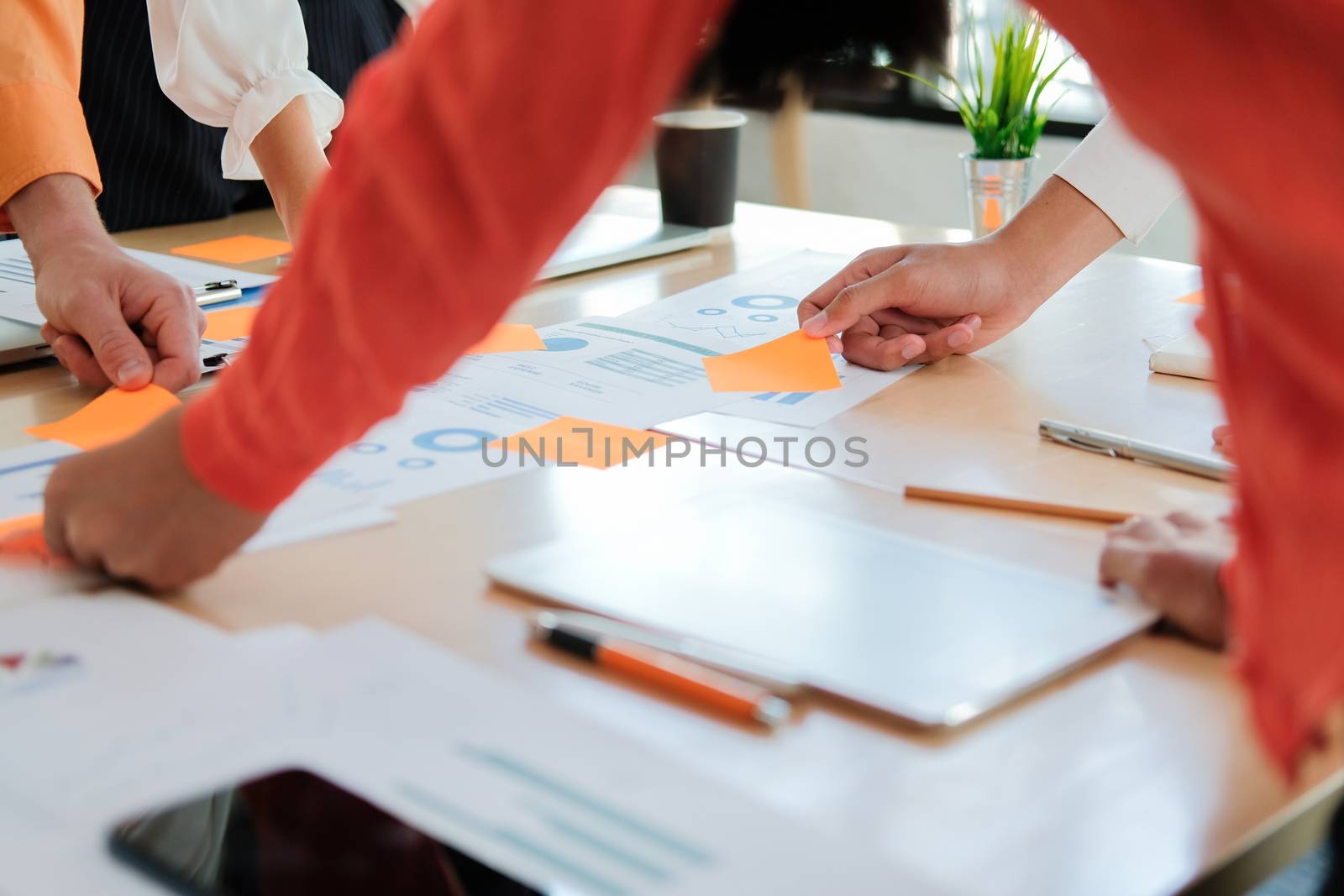 business people discussing on performance revenue in meeting. businesswoman working with co-worker team. financial adviser analyzing data with investor.