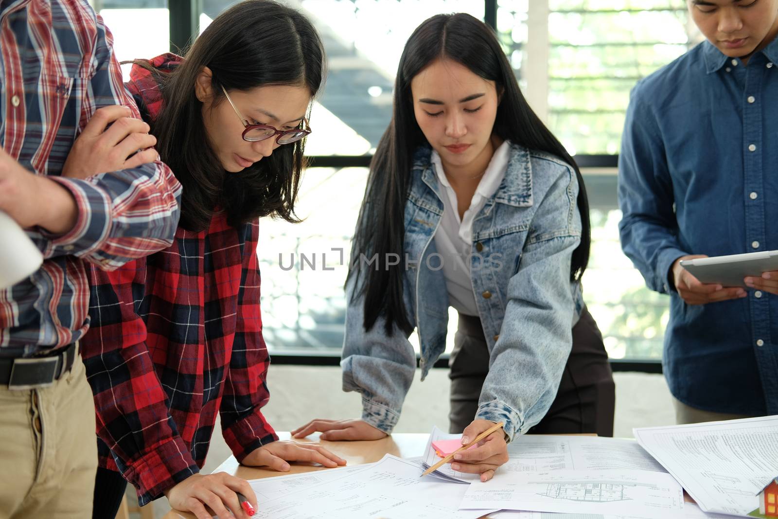 architect engineer interior designer team working discussing on house blueprint of real estate project in meeting. building construction teamwork concept