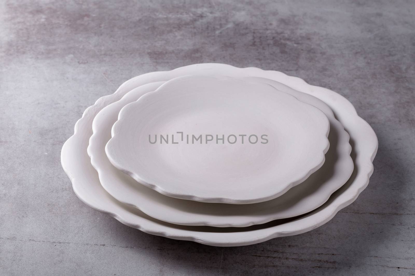 Empty blank white ceramic dish on Cement Board by kaiskynet